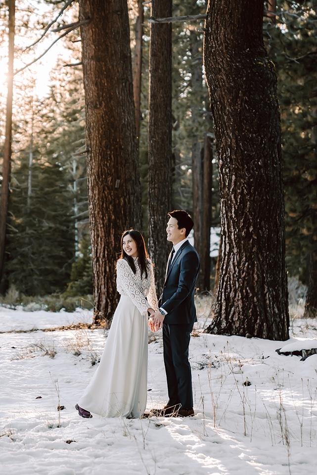 Bride and groom in the snow at their winter elopement in Tahoe