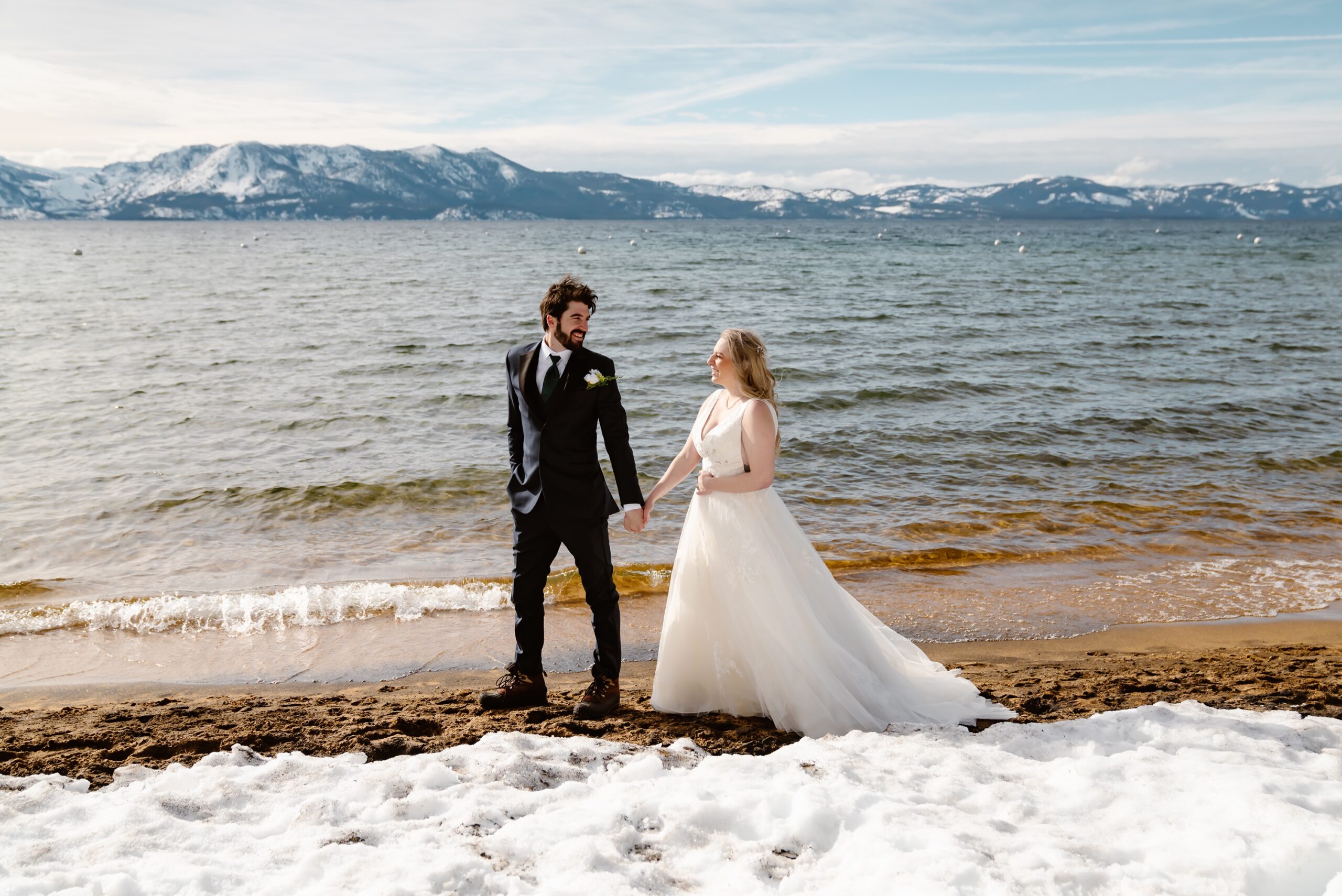 Bride and groom on the beach of Zephyr Cove