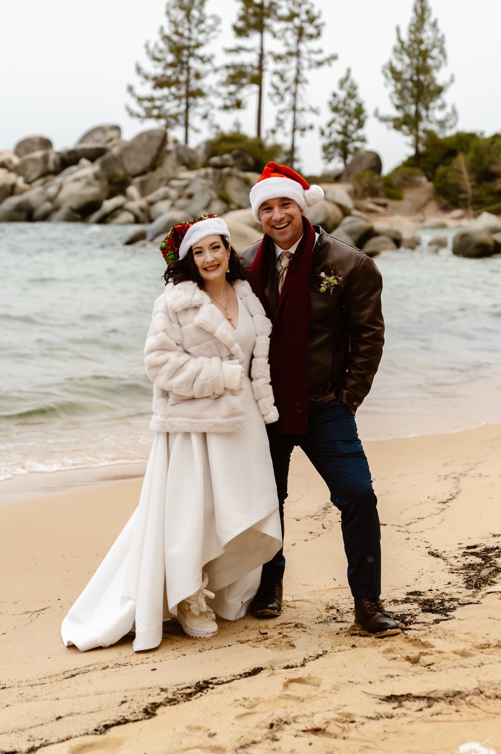 Bride and groom wearing Santa hats at mountain elopement