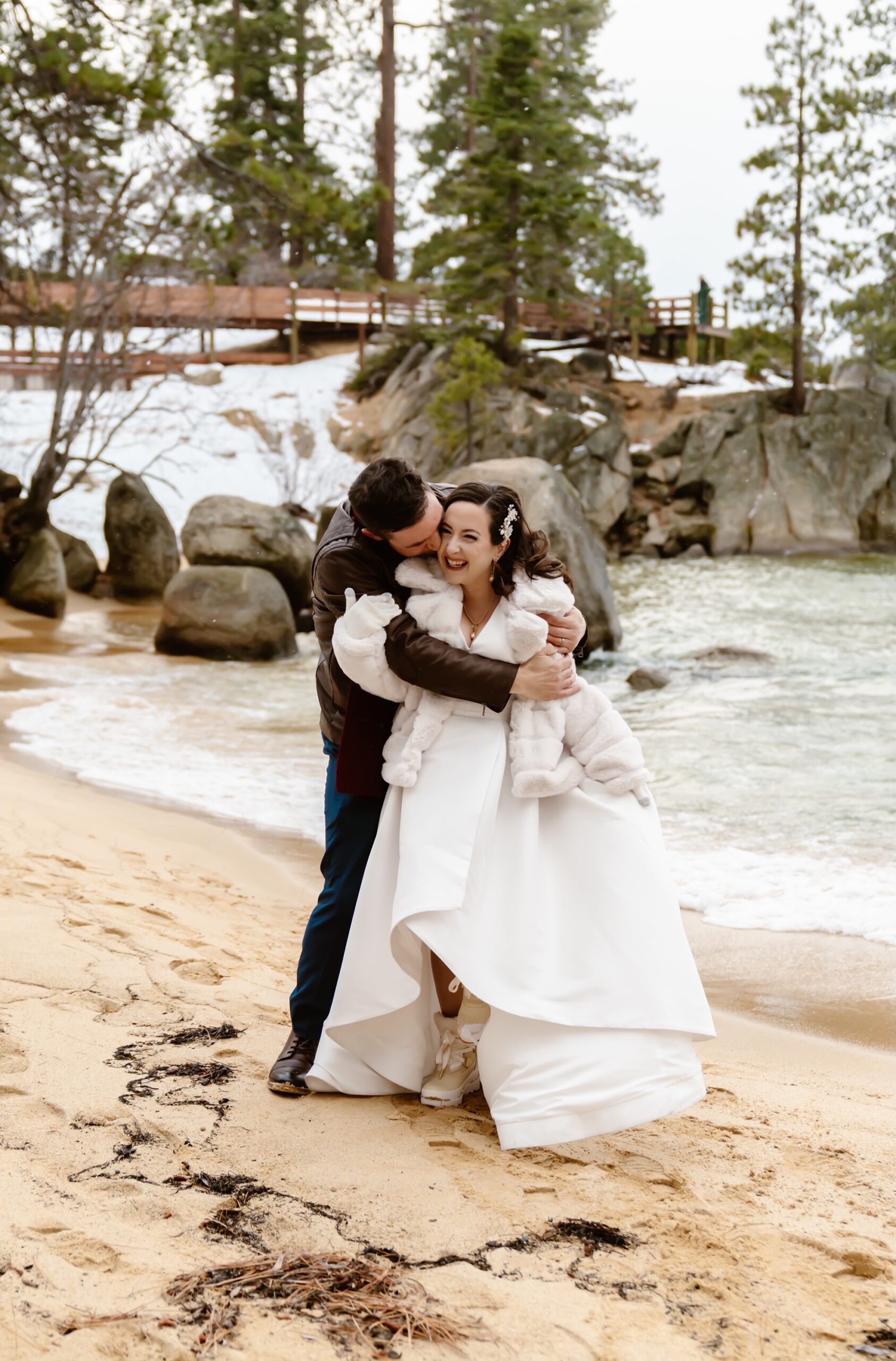 Bride and groom hug at their mountain elopement