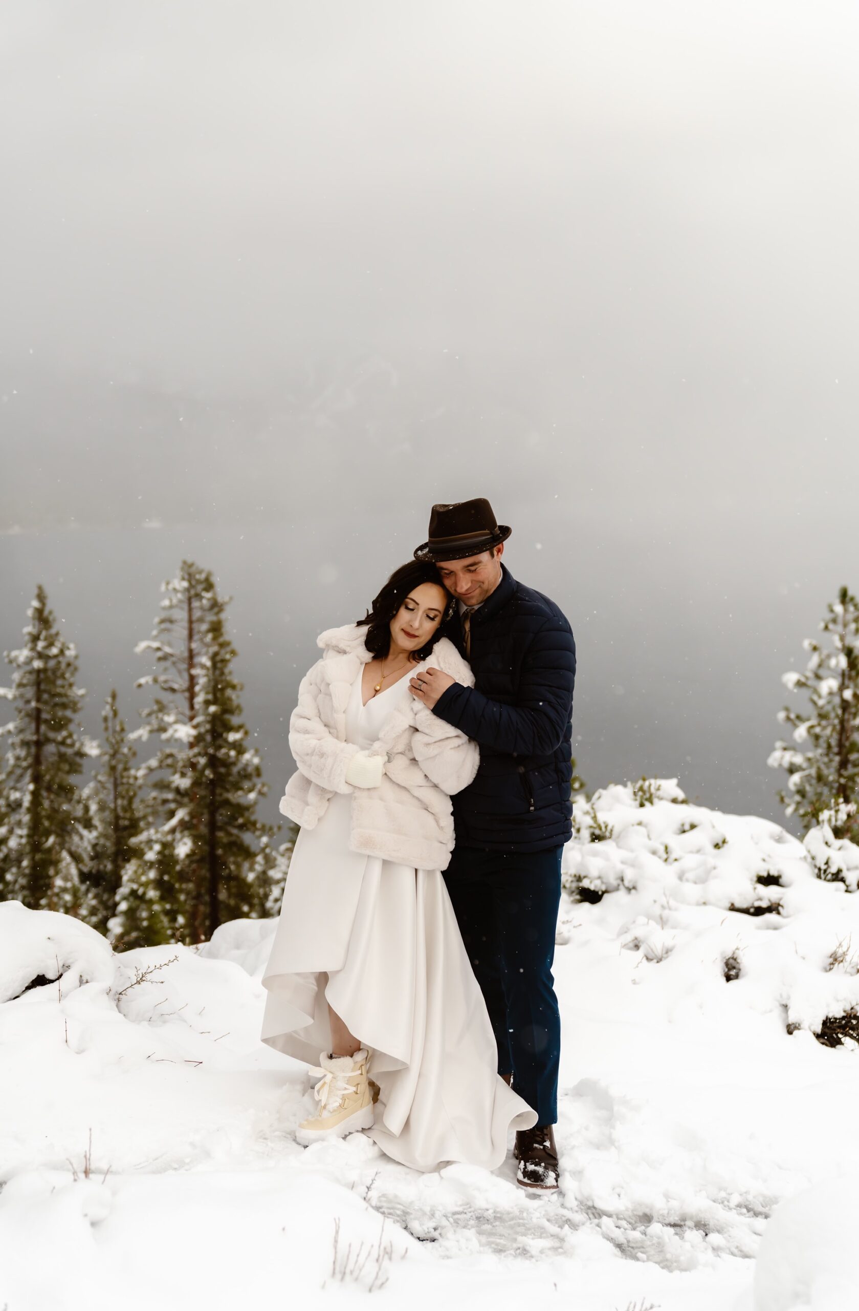Bride and groom at their snowy mountain elopement