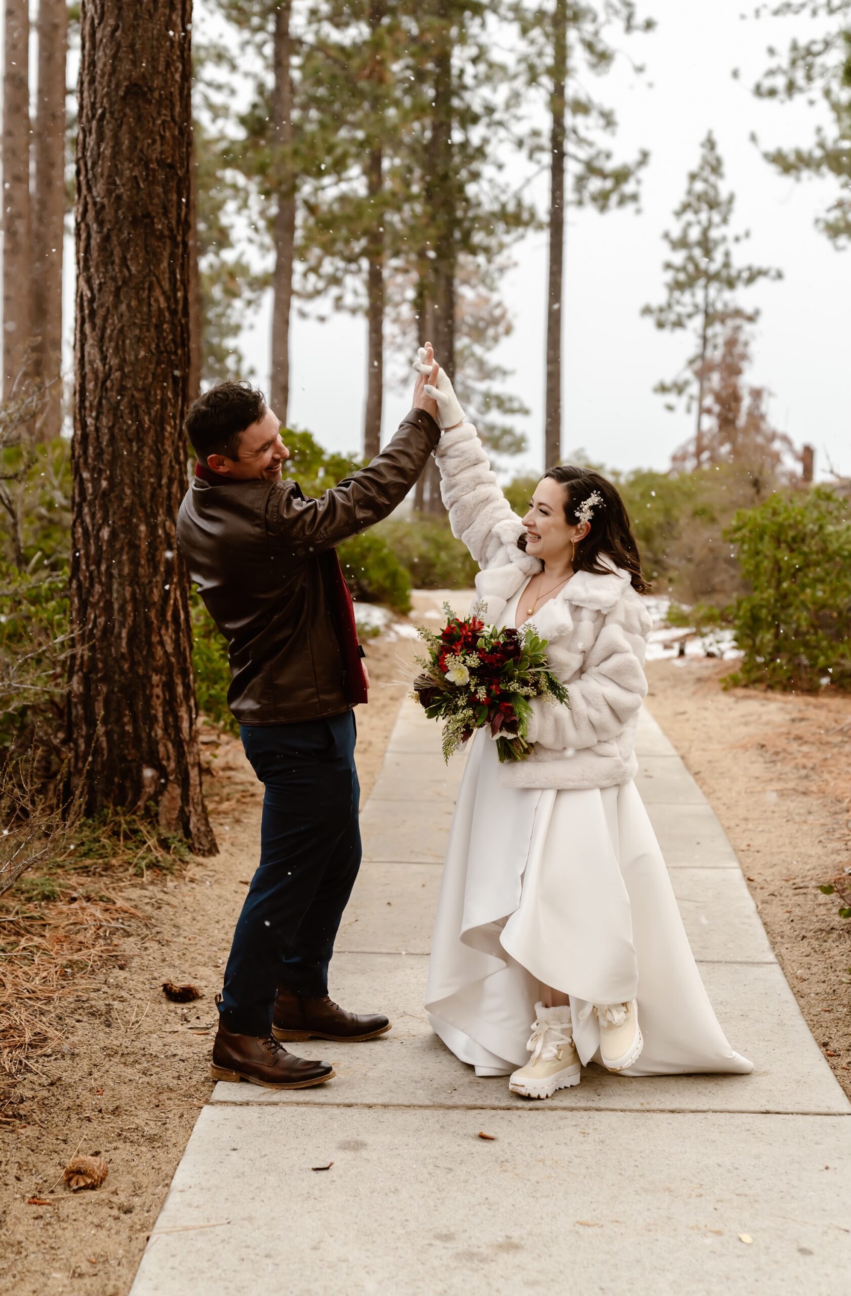 Couple dances at their snowy mountain elopement