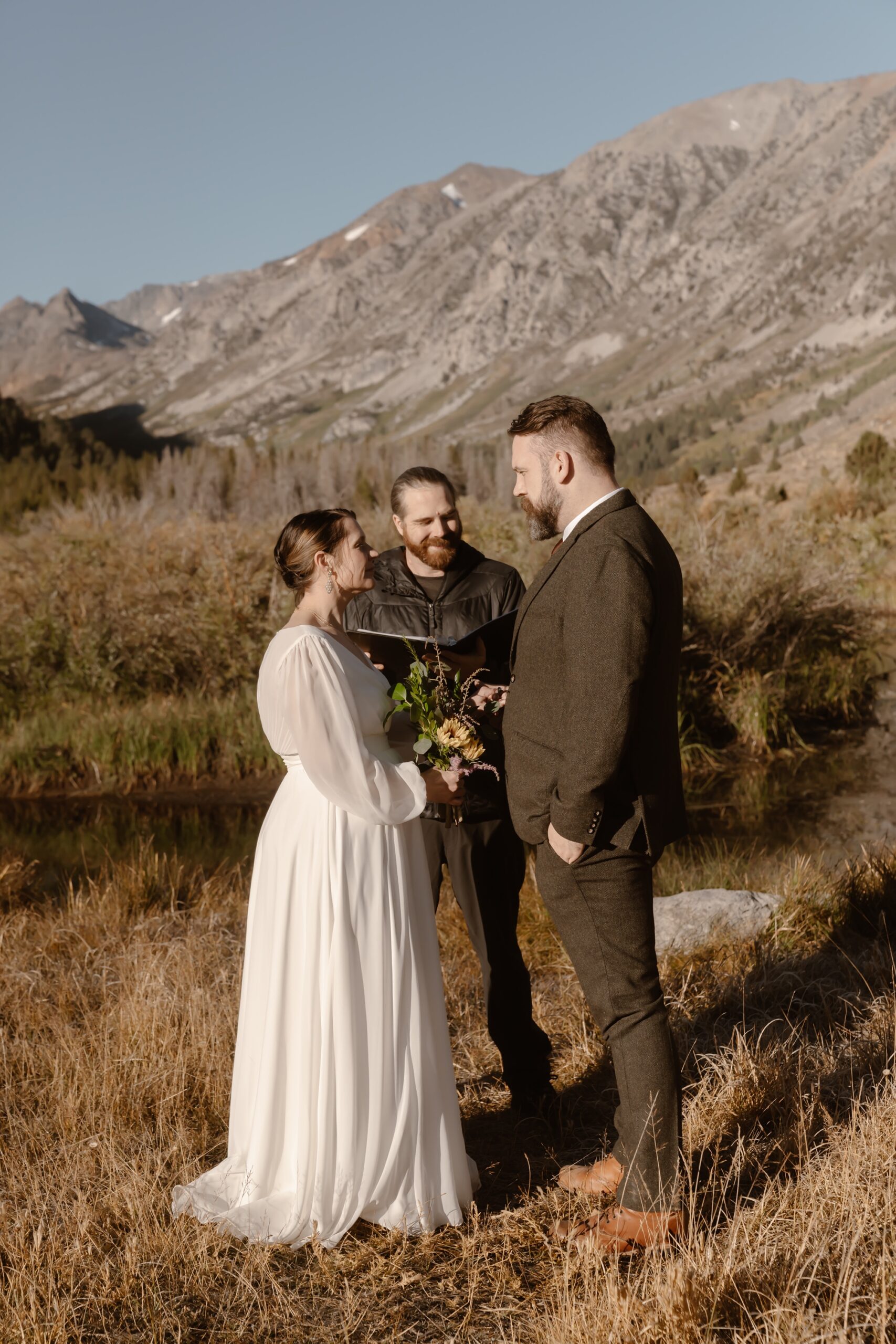 Bride and groom say vows at sunrise elopement ceremony