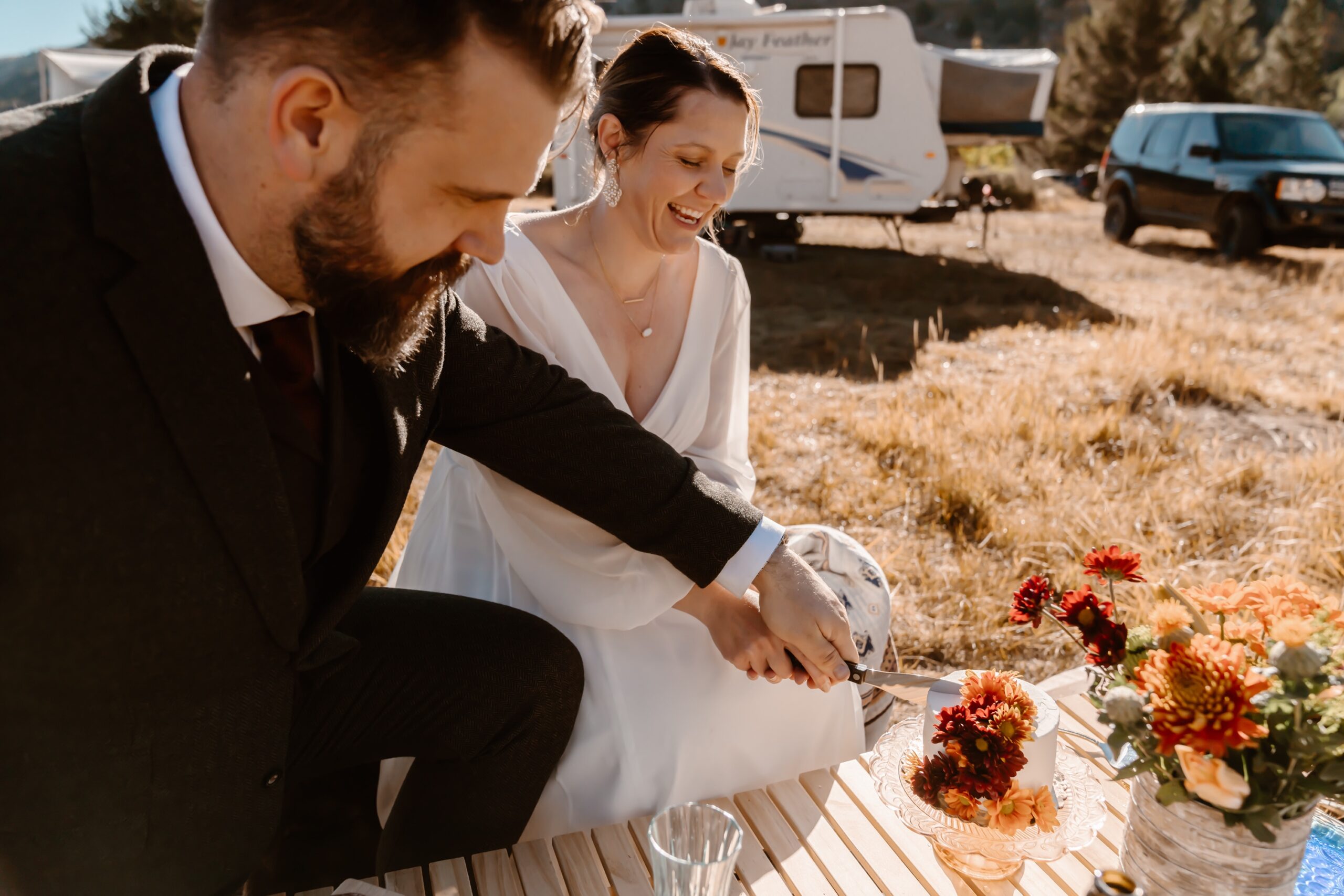 Bride and groom cut cake at Mono Lake elopement ceremony
