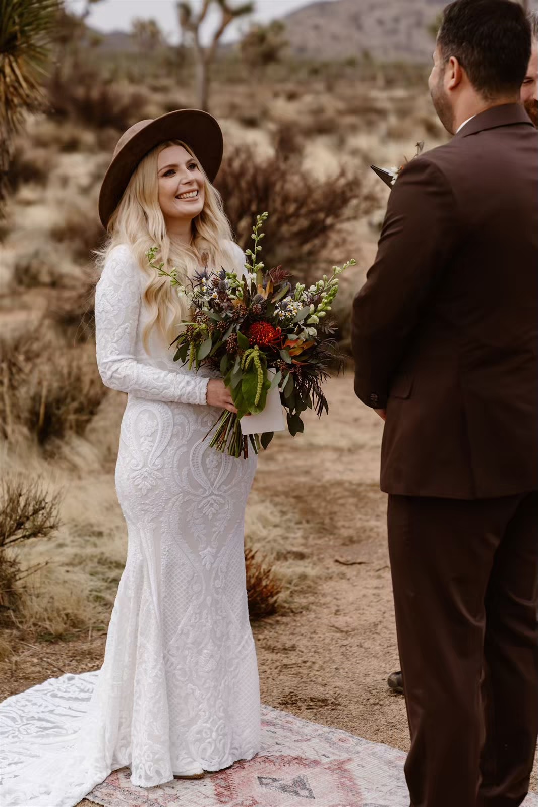 Bride and groom say vows at their Joshua Tree elopement ceremony