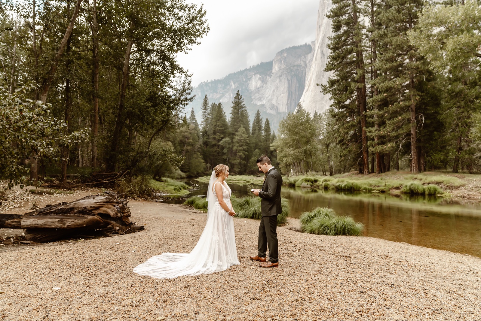 Bride and groom say vows at Cathedral Beach Yosemite wedding