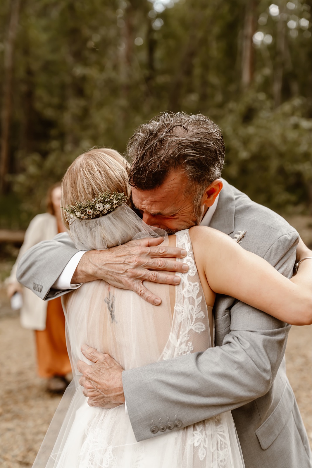 Emotional hug after the Cathedral Beach Yosemite wedding ceremony