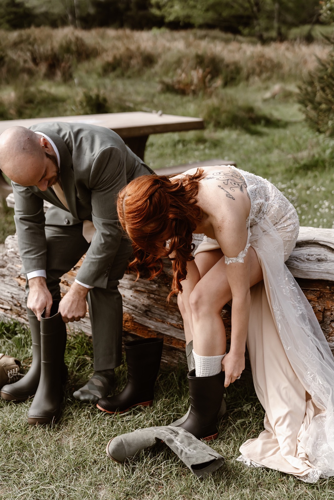 Bride and groom put on boots for Fern Canyon elopement photos