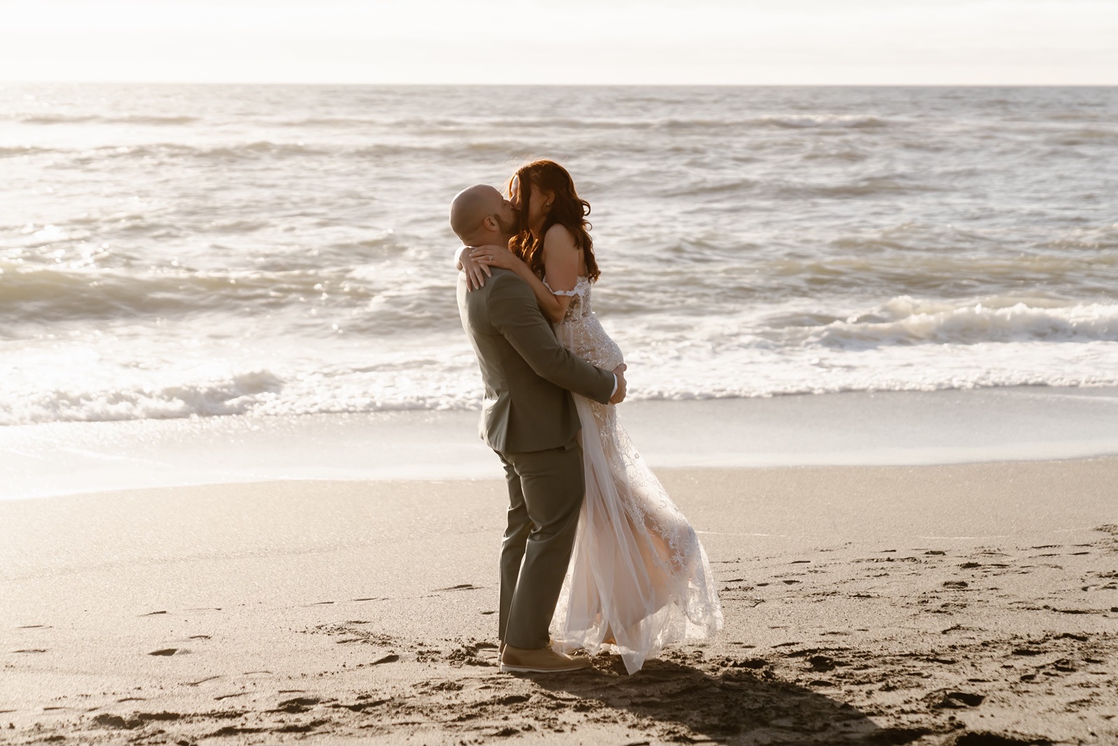 Bride and groom kiss at Gold Beach elopement