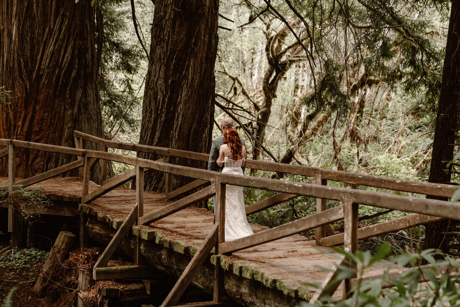 Bride and groom on a bridge at their Fern Canyon elopement