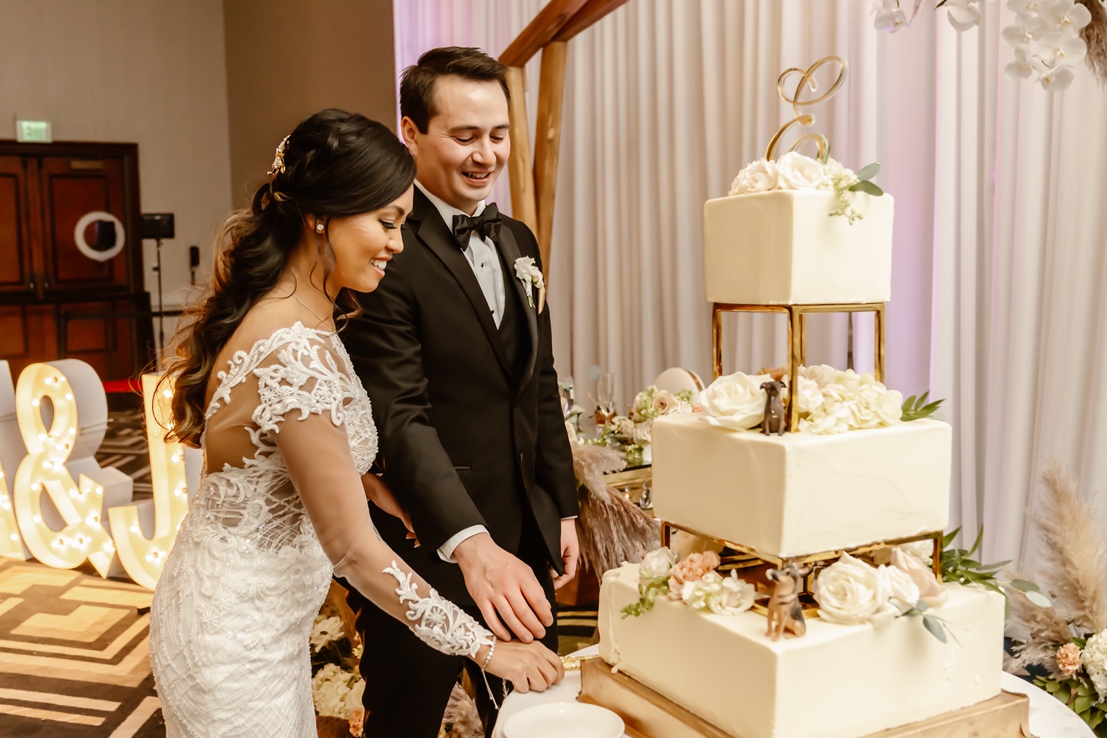 Bride and groom cut their wedding cake at their Everline Resort and Spa wedding
