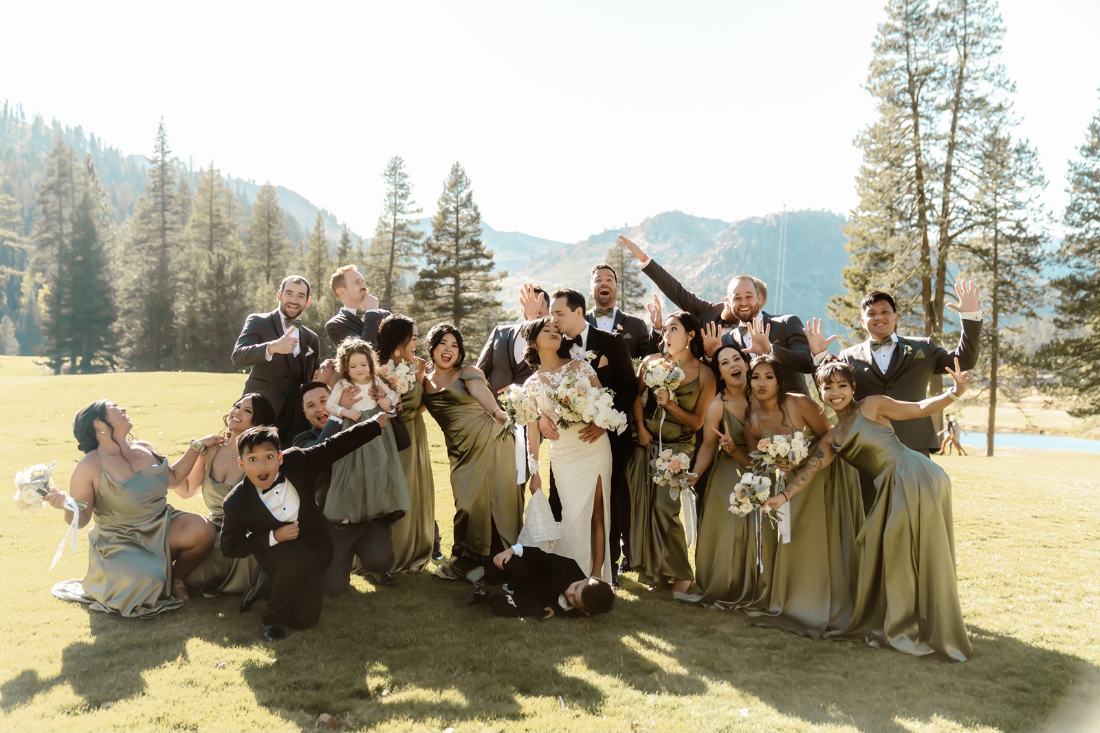Bride and groom strike a funny pose with their bridesmaids and groomsmen at Everline Resort