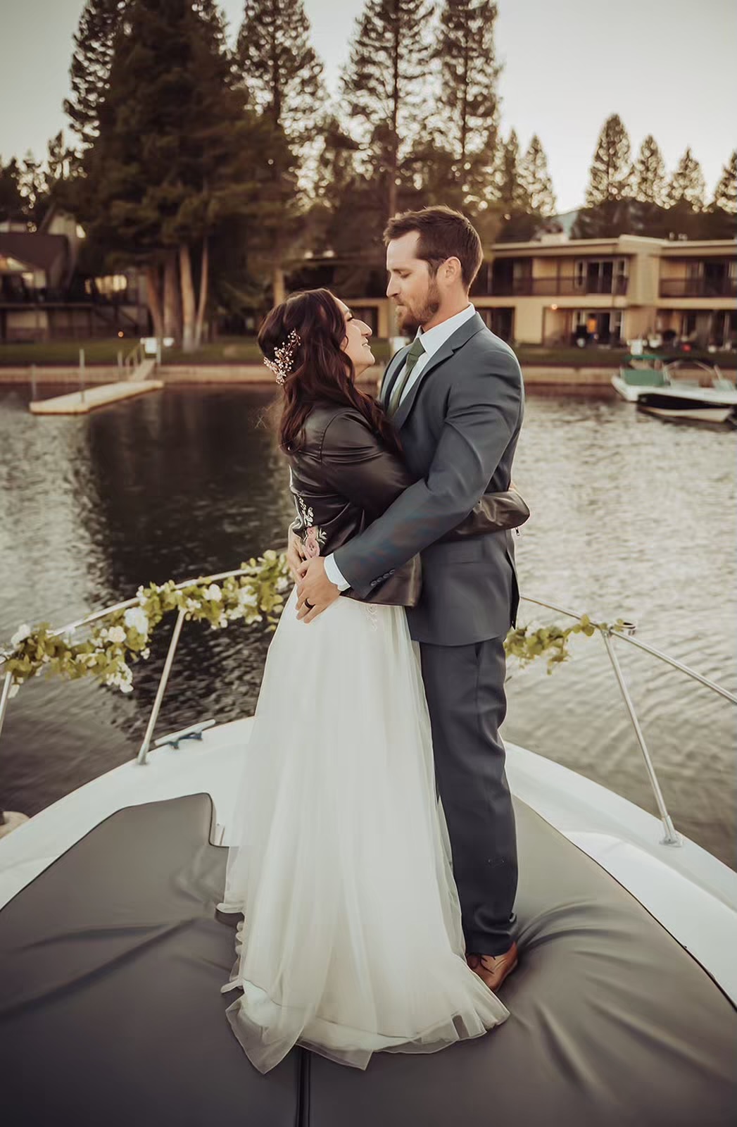 Bride and groom pose for Lake Tahoe boat wedding photos