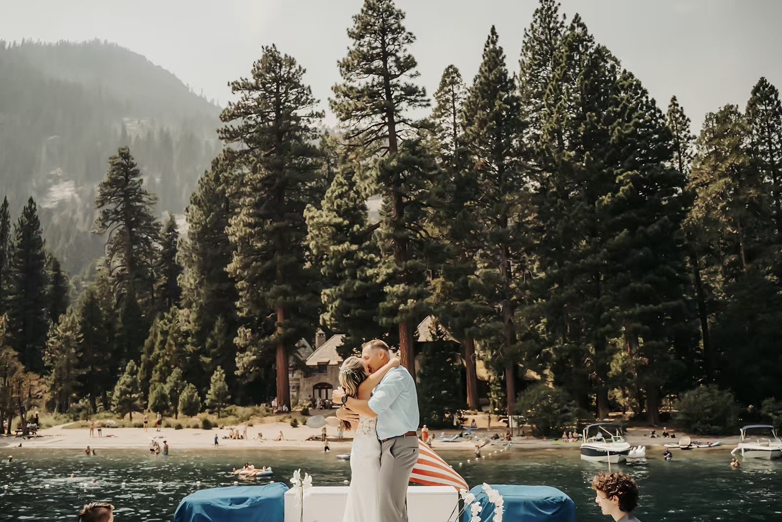 Couple kisses at their boat wedding on Lake Tahoe