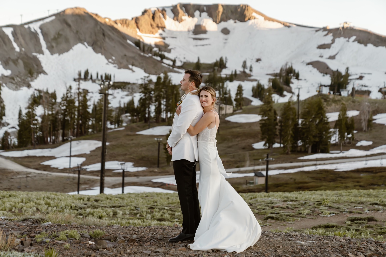 Bride and groom hug during couples portraits at the Palisades wedding