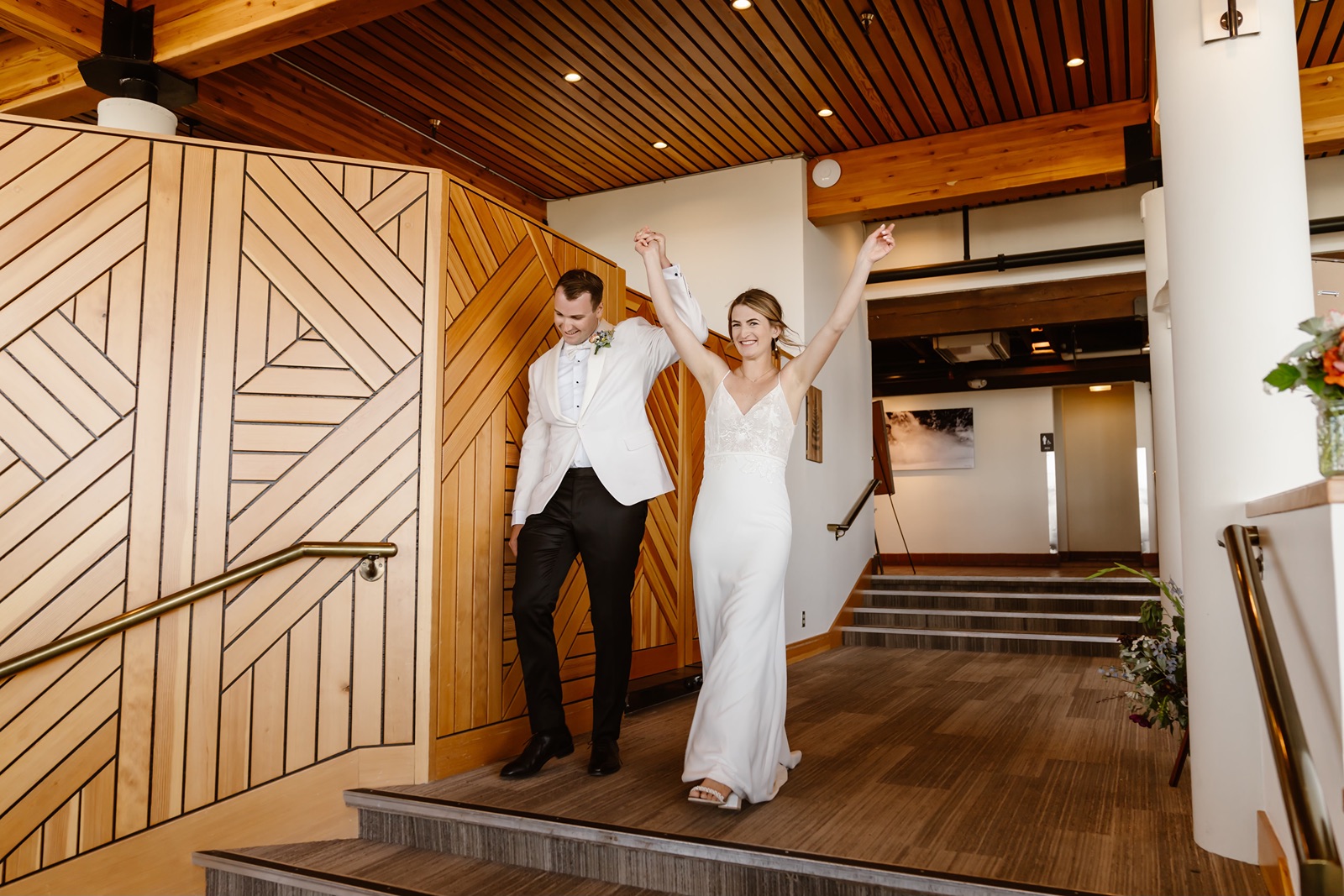 Bride and groom enter their Palisades wedding at the Upper Deck at High Camp