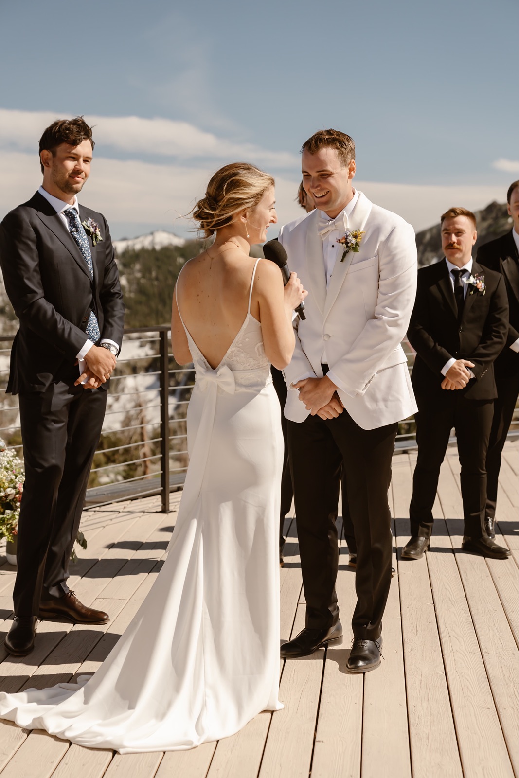 Bride holds microphone for wedding vows at the Palisades wedding