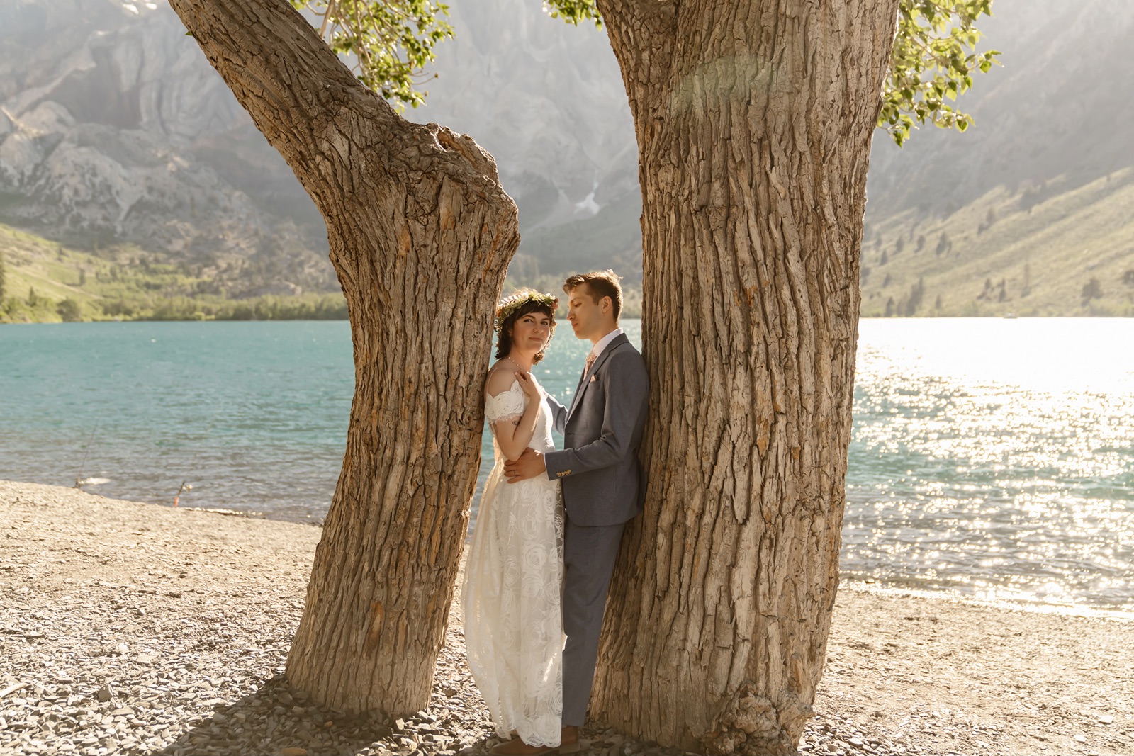 Bride and groom pose for couples portraits at their Convict Lake Resort wedding