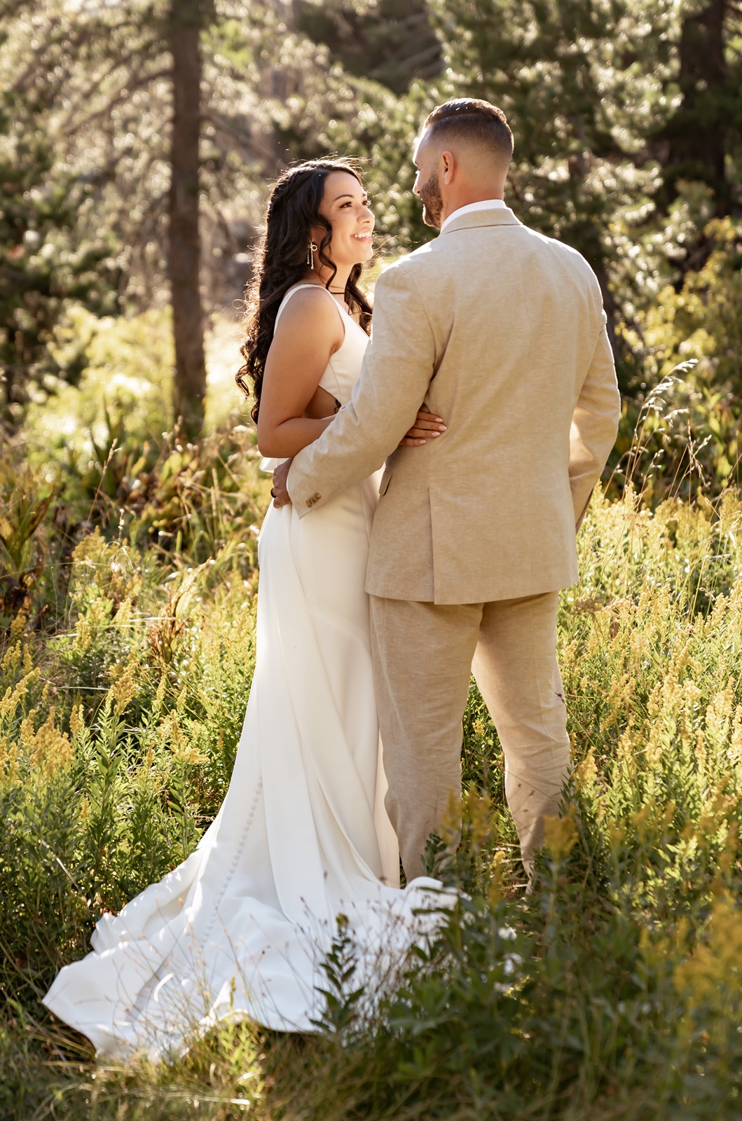 Bride and groom embrace at their Hideout at Kirkwood in California wedding