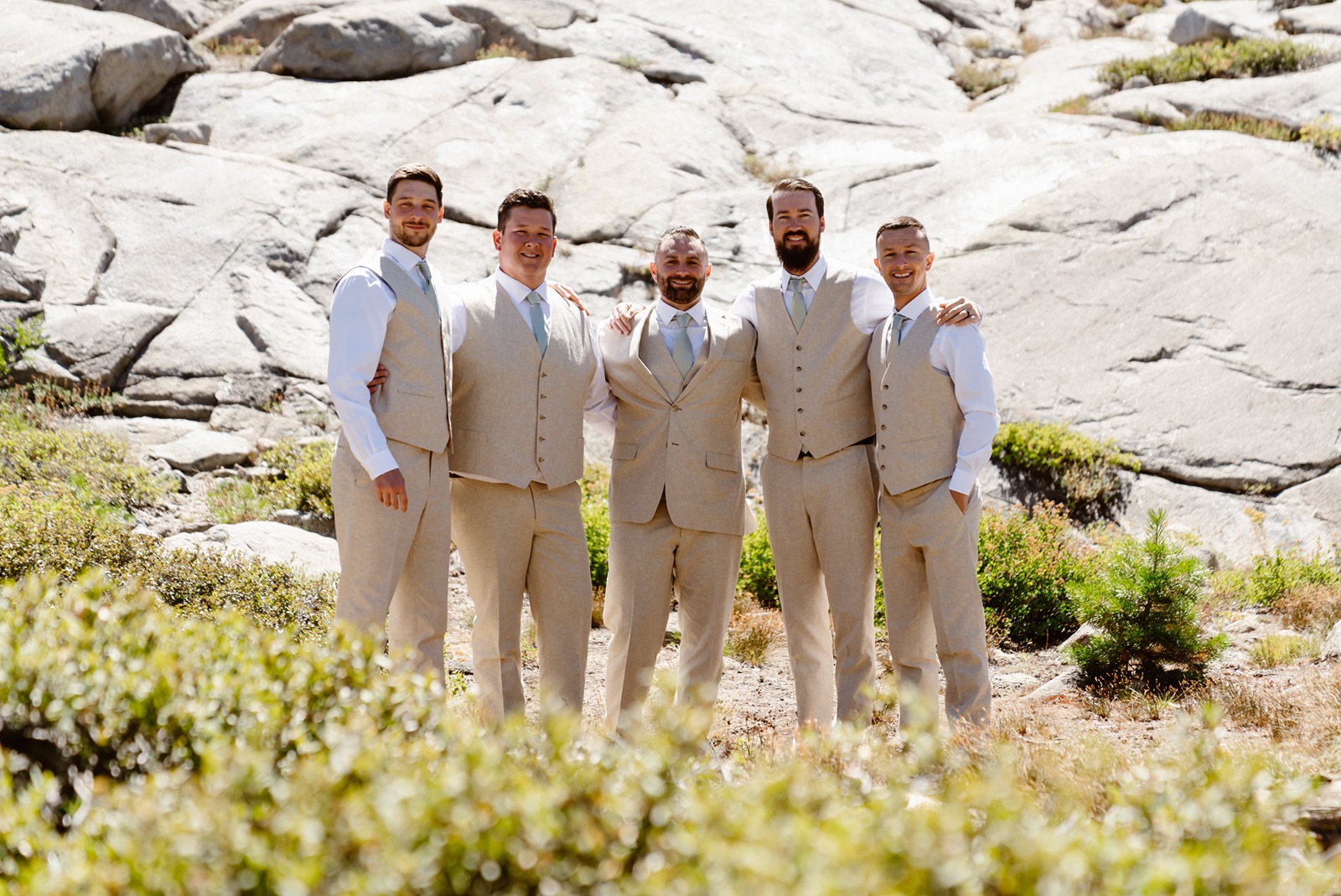 Groom and groomsmen smile at the Hideout at Kirkwood wedding