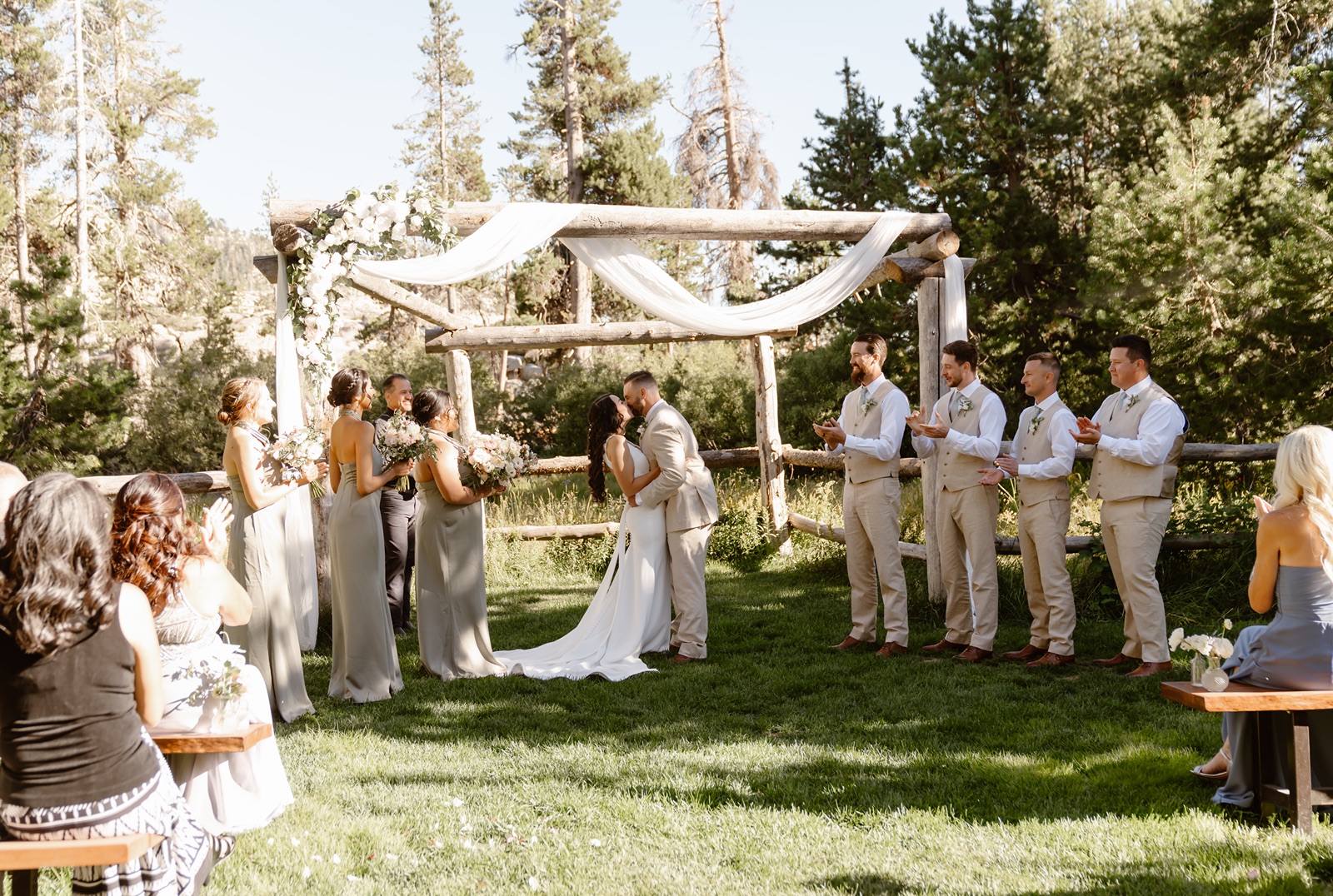 Bride and groom kiss during Hideout at Kirkwood wedding ceremony