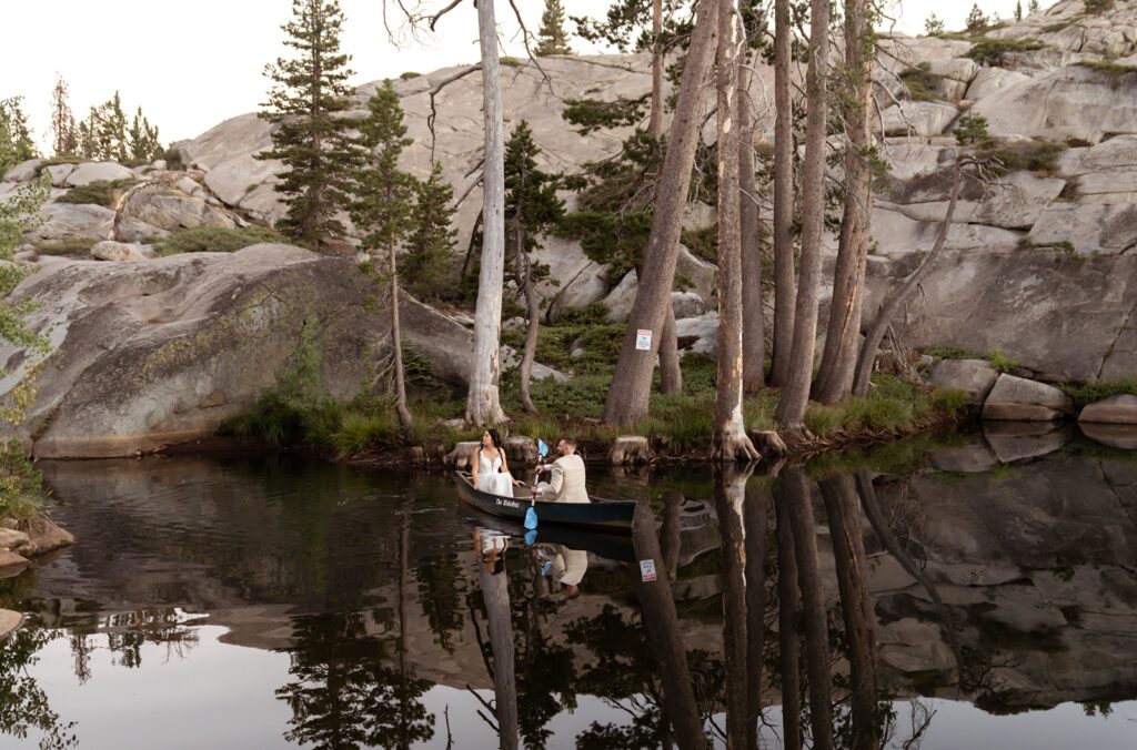 Bride and groom in a canoe at their Hideout at Kirkwood wedding