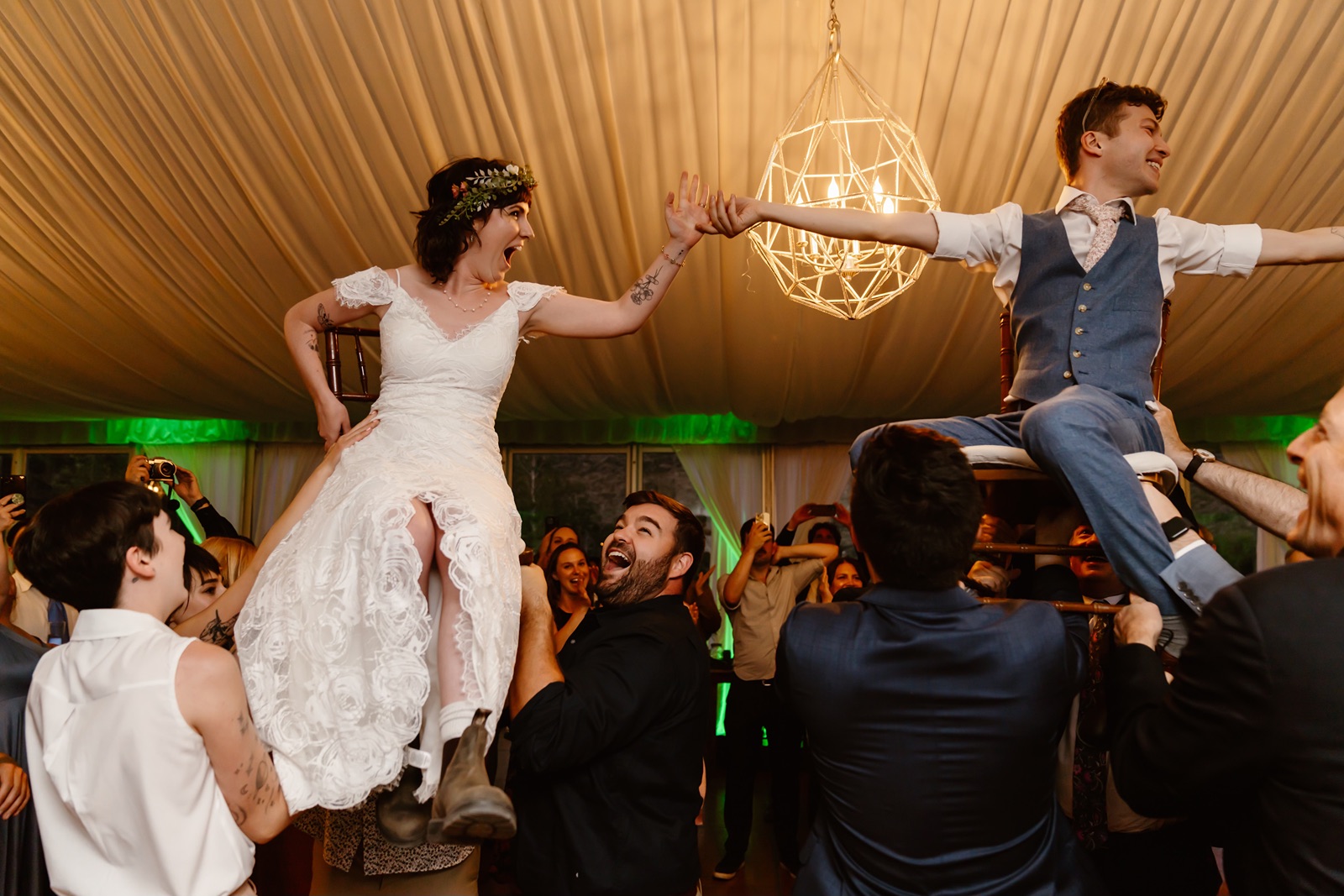 Couple is lifted during the hora dance at their Convict Lake Resort wedding reception