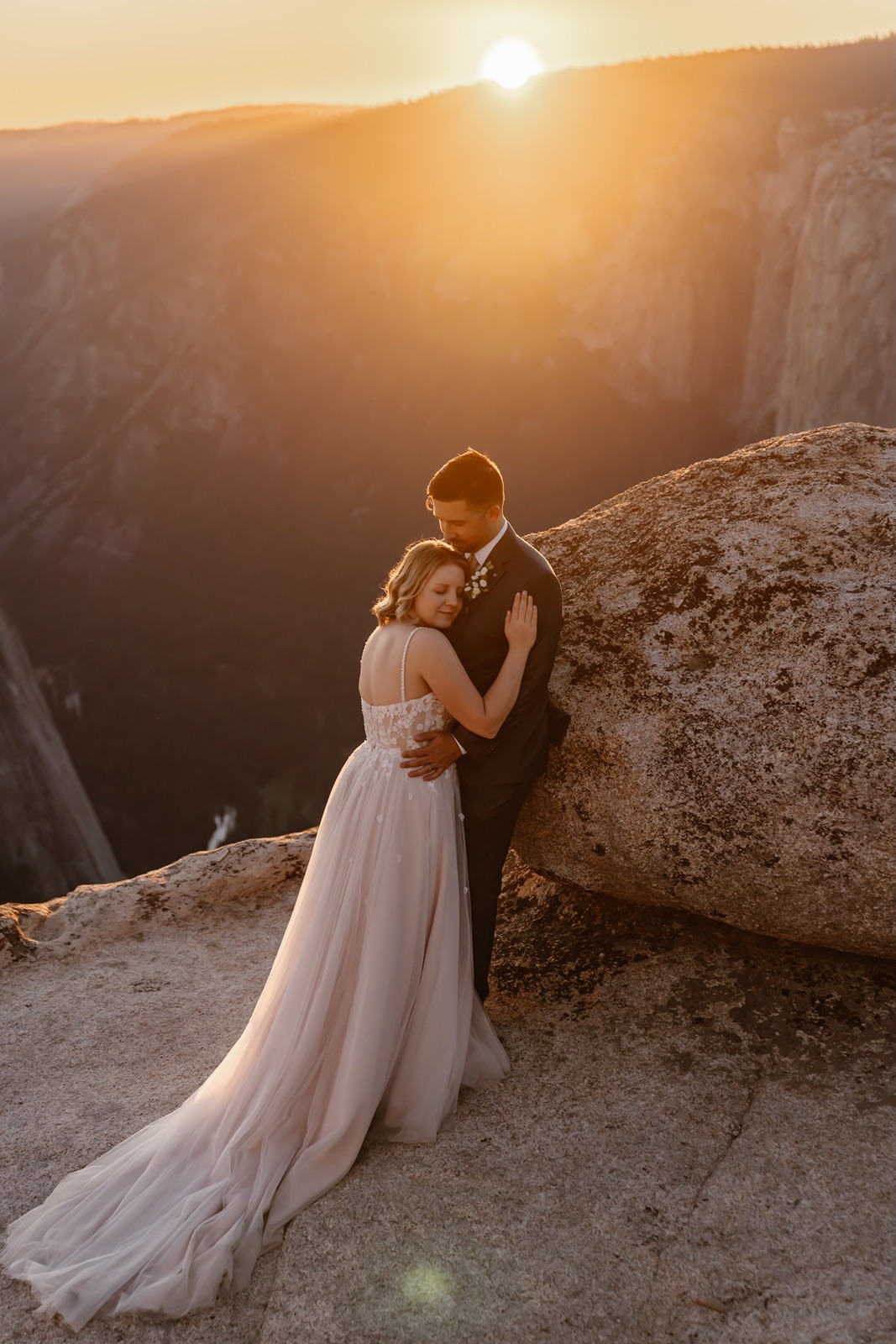 Couple hugs at sunset during their Yosemite elopement pictures