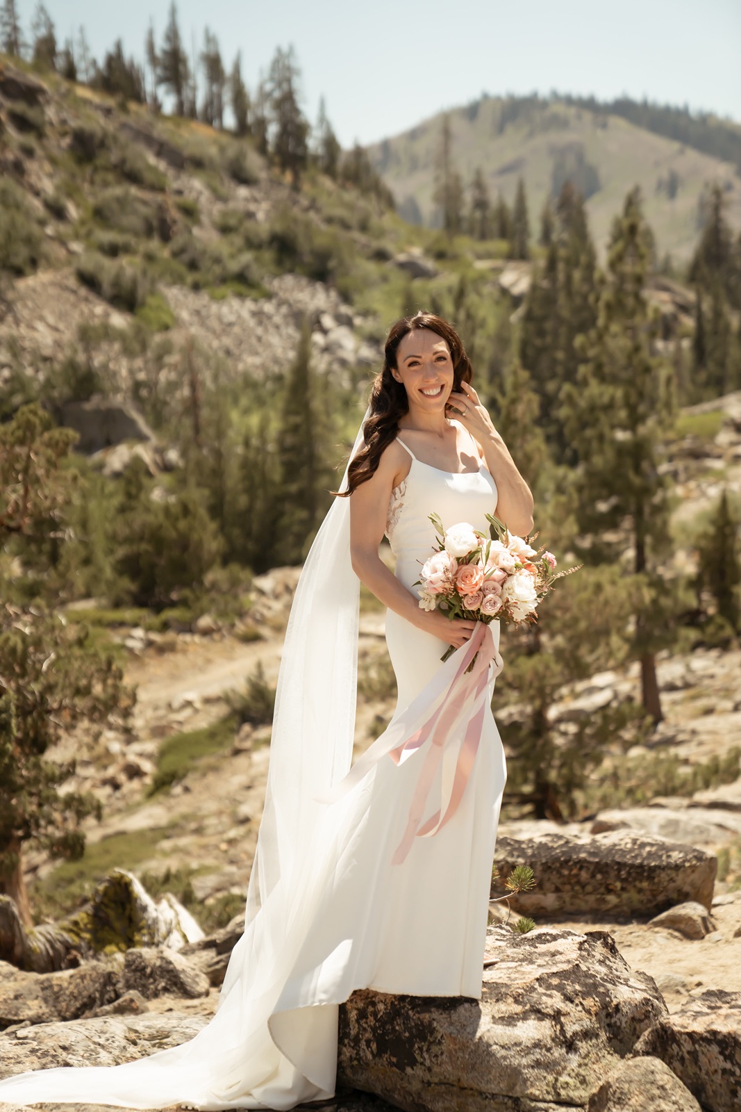 Bride smiles at the camera at Donner Lookout