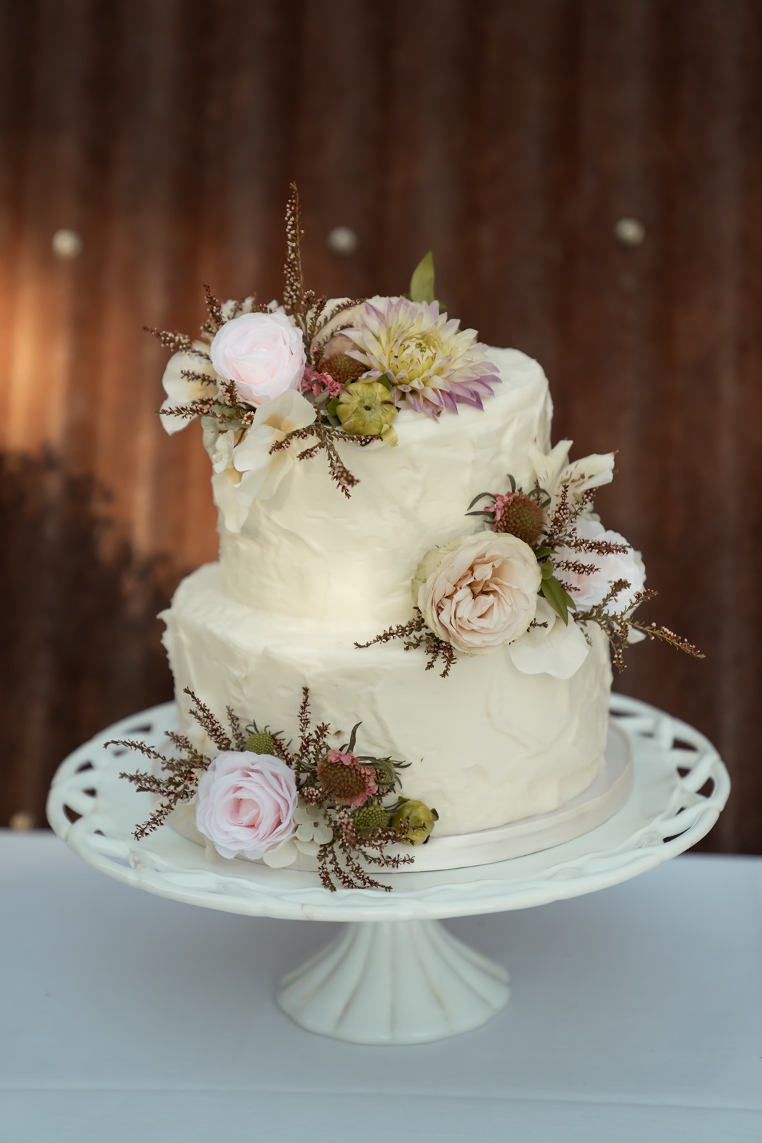 Two tier wedding cake with flower accents