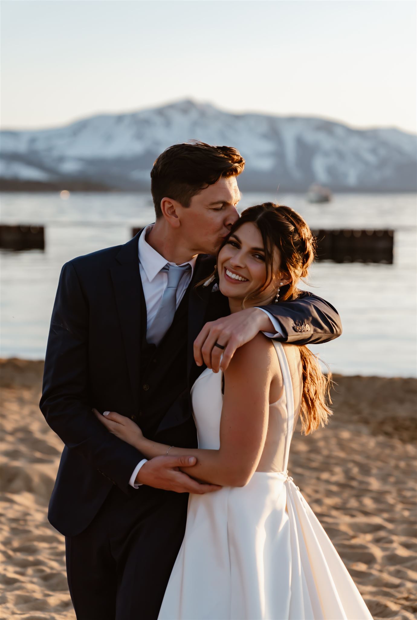 Bride and groom on a beach at Lake Tahoe