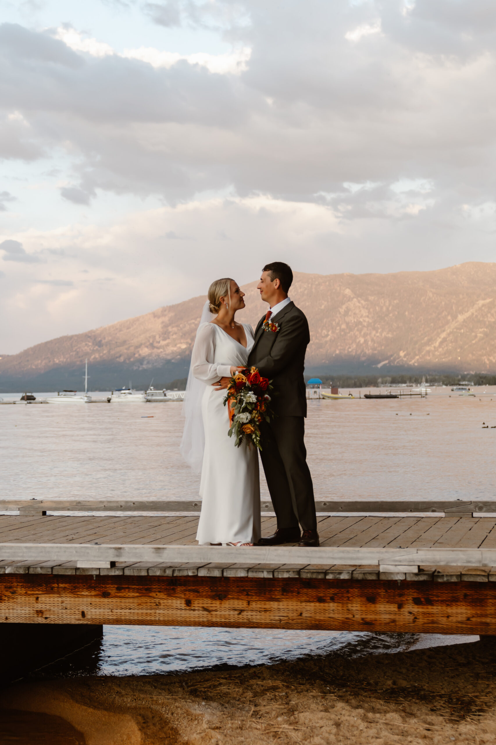 Bride and groom at sunset with Lake Tahoe backdrop