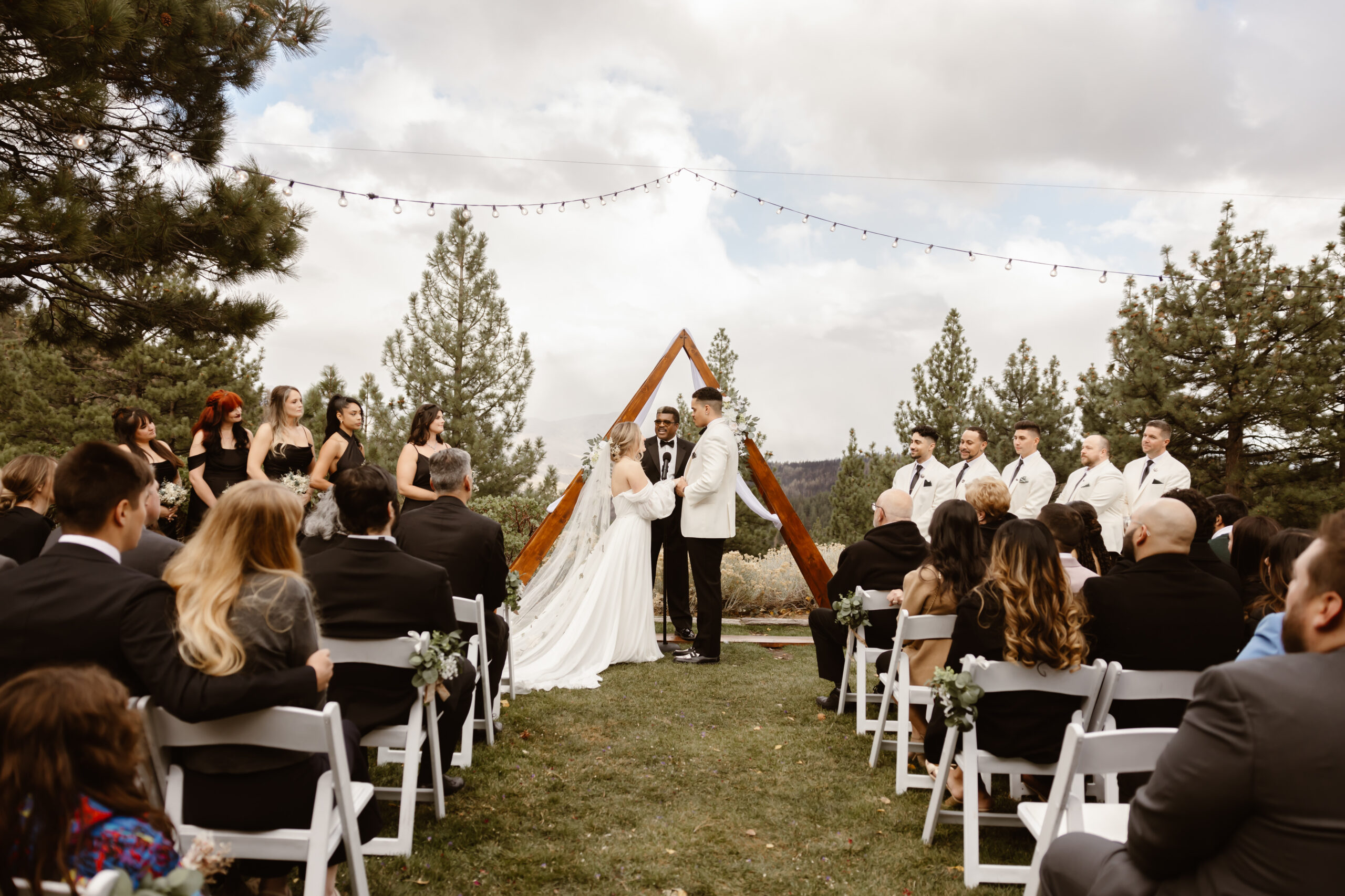 Guests watch on as the bride and groom say their vows