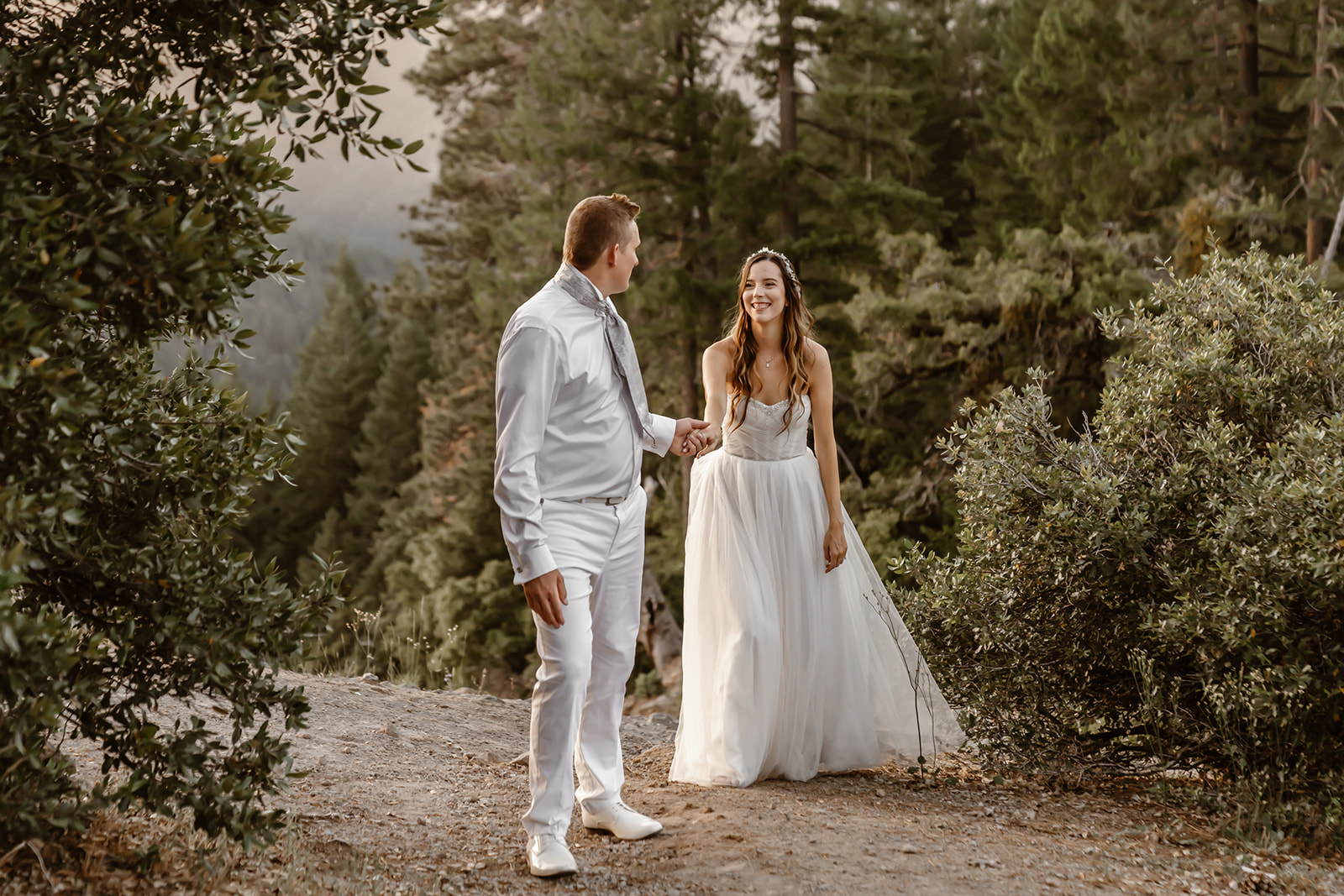 Bride and groom explore vista near Harmony Ridge Lodge