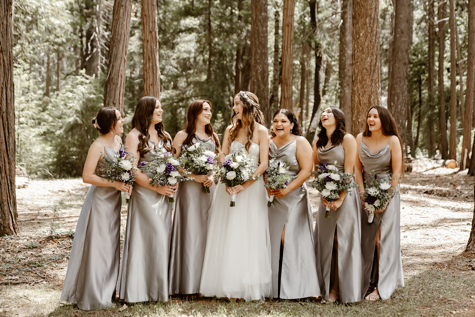 Bride with bridesmaids pose at Harmony Ridge lodge