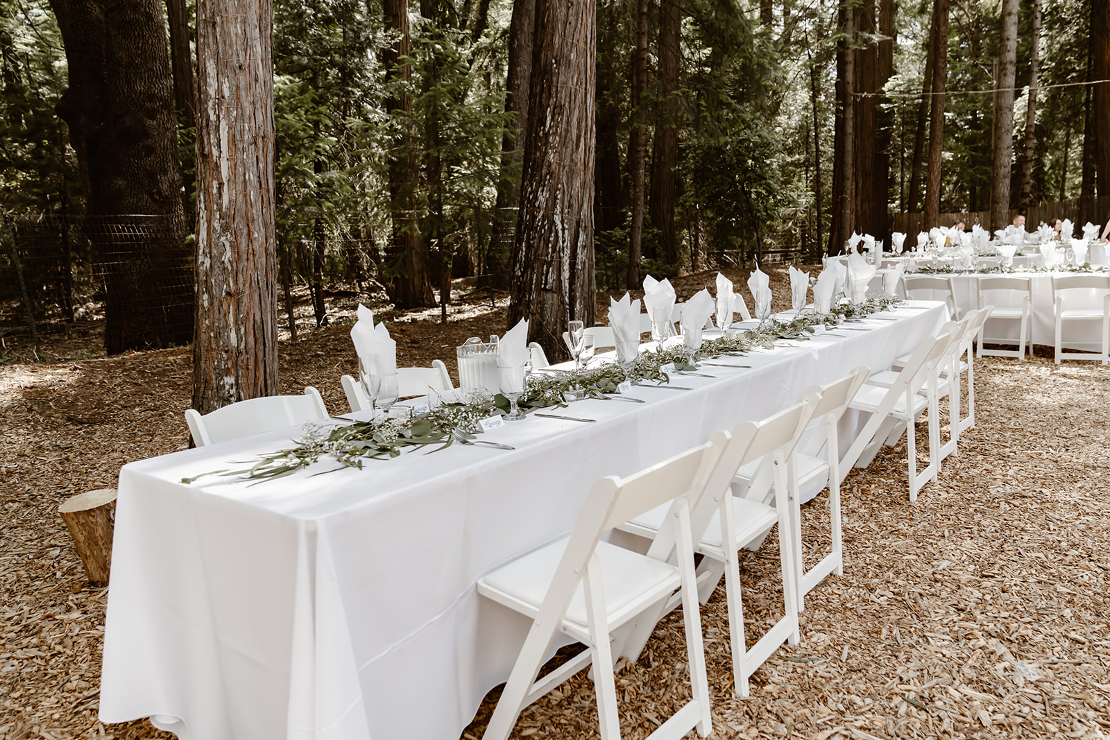 Long rectangular tables with white tablecloths at Harmony Ridge Lodge