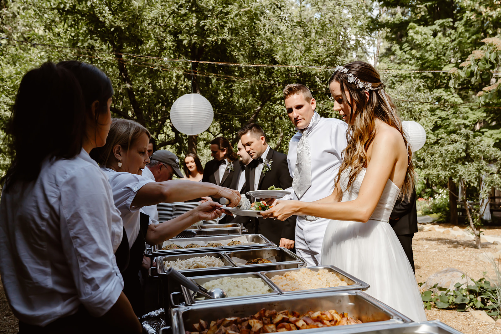 Bride and groom enjoy the buffet at Harmony Ridge Lodge