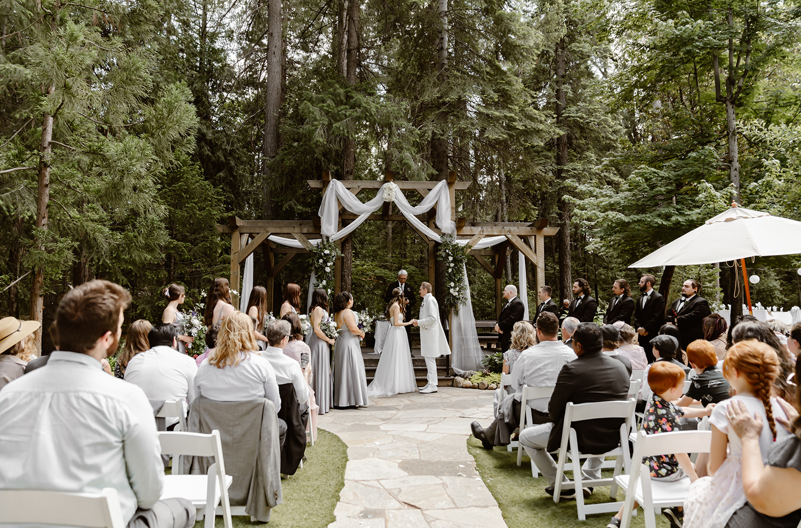 Bride and groom say their vows at the outdoor wedding ceremony