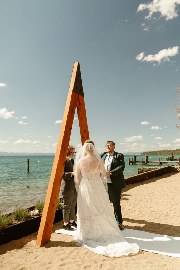 Bride and groom say vows at their Arch at Lakeside wedding