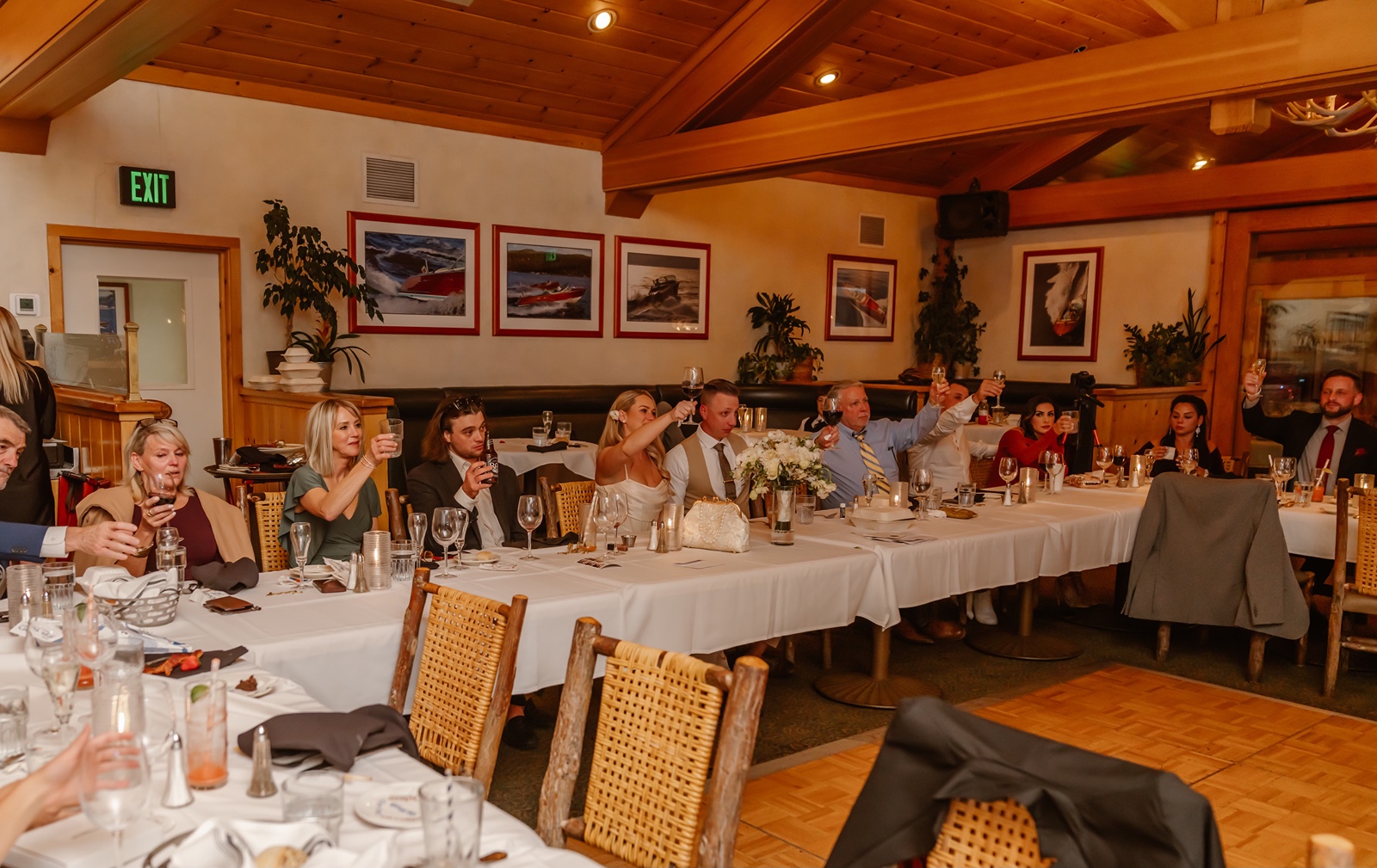 Wedding guests toast to newlyweds at the Gar Woods wedding