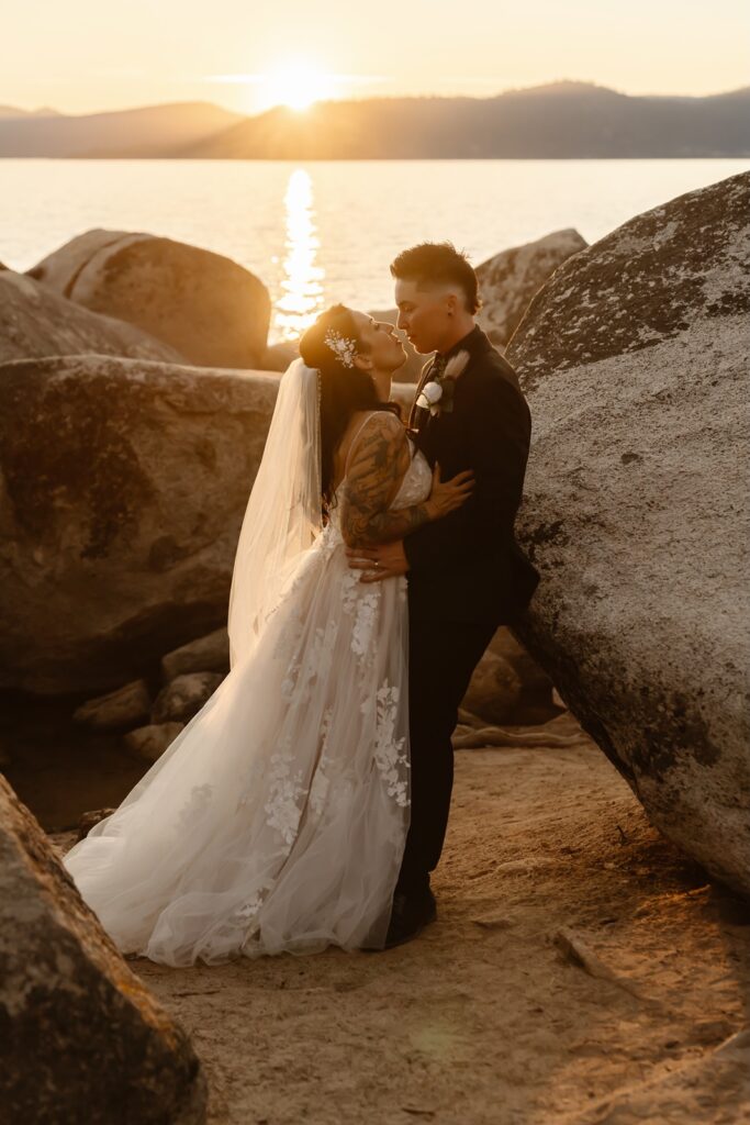 Couple poses for sunset photos at Sand Harbor elopement