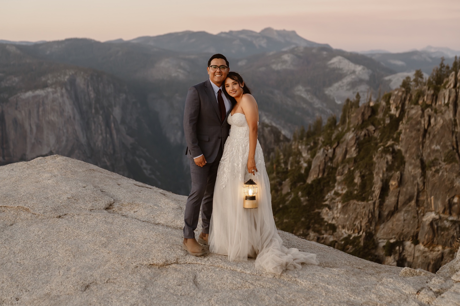 Couple holding lanterns at their Taft Point elopement photos