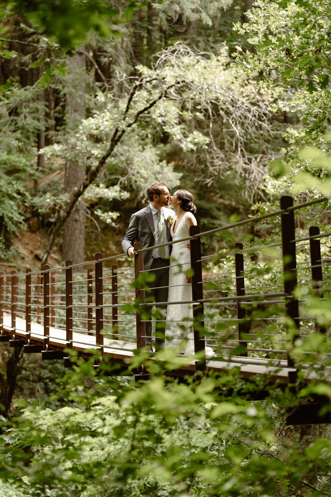 Bride and groom on a bridge at Miners Foundry