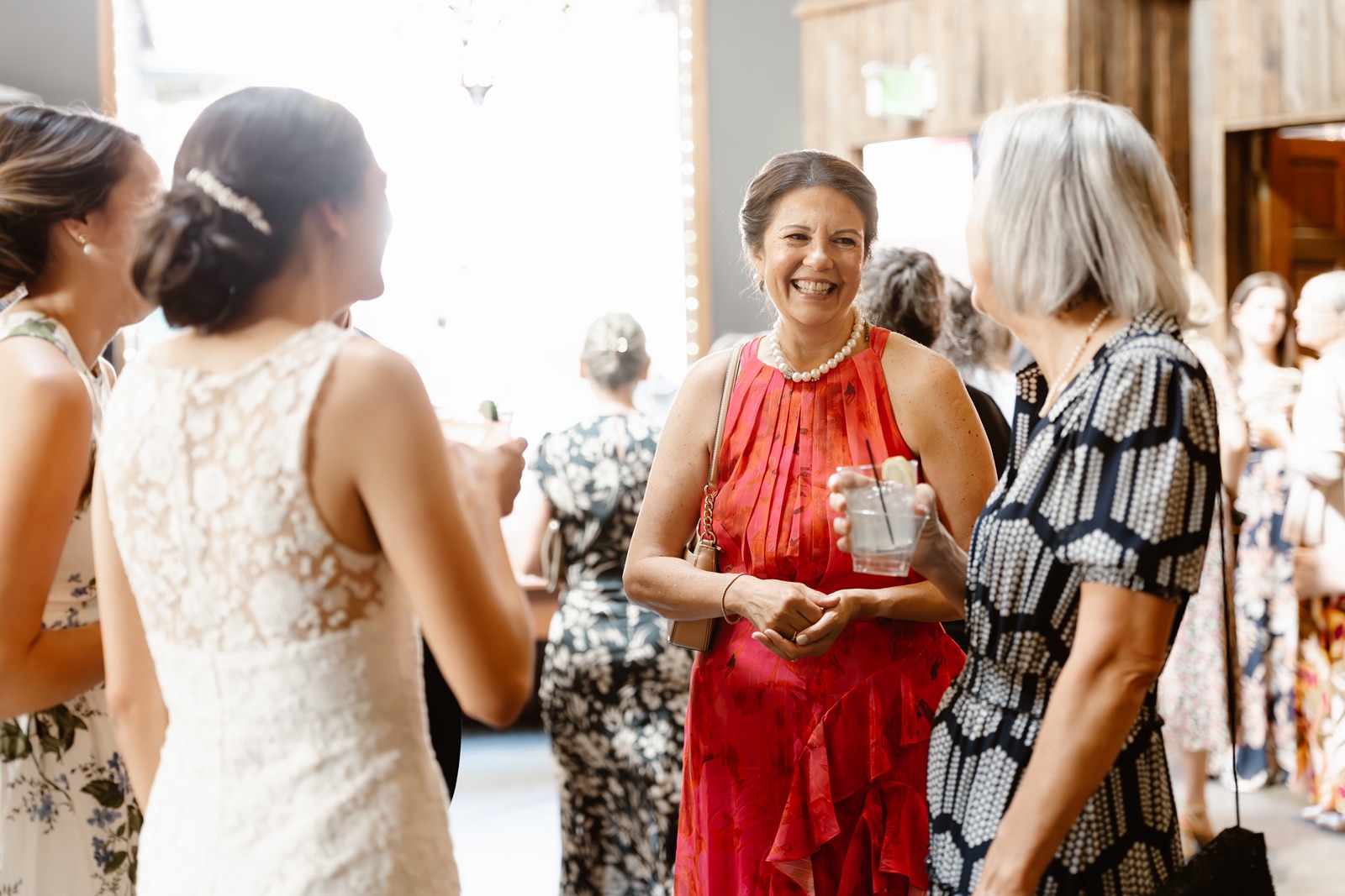 Bride talks to guests at Miners Foundry cocktail hour