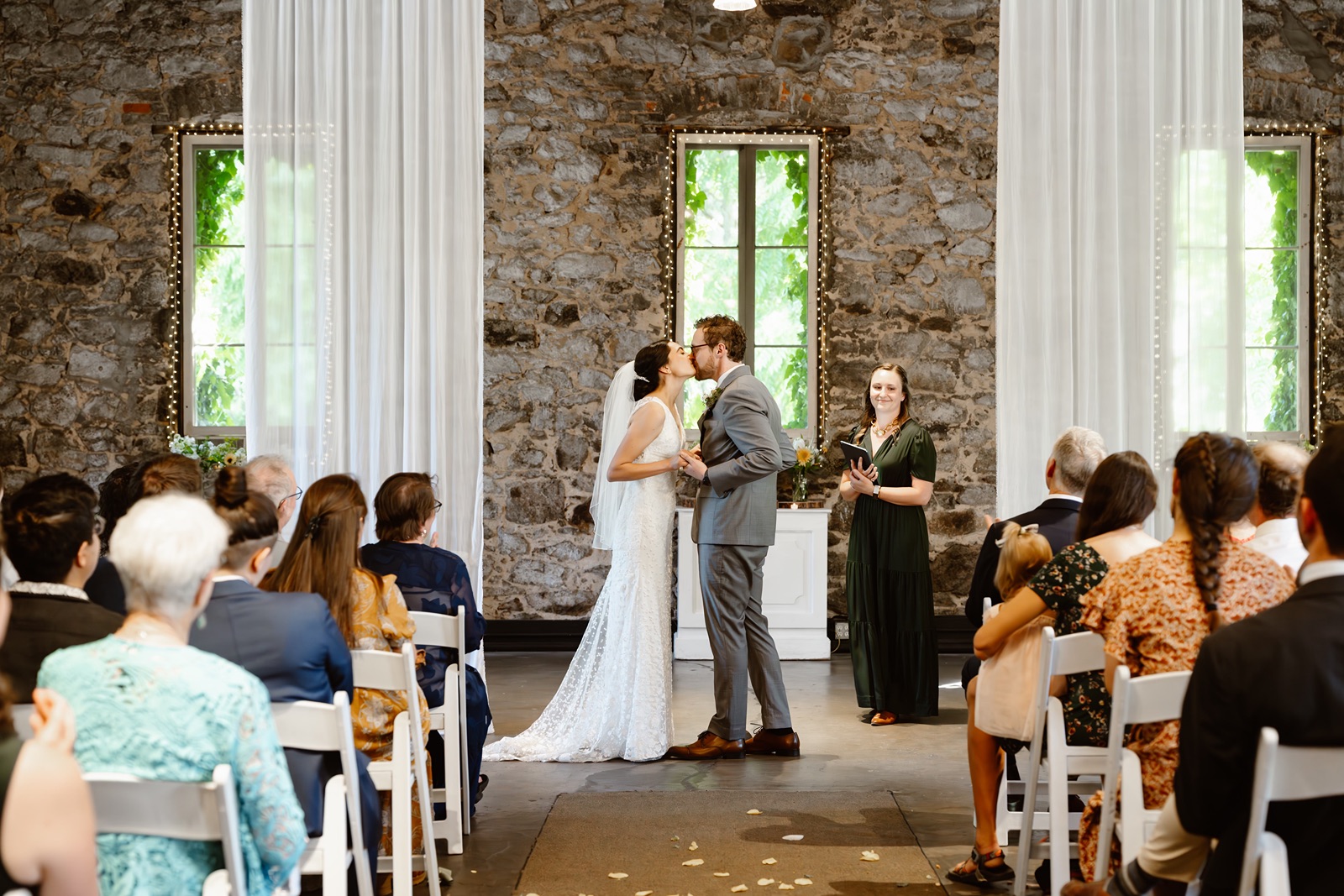 Bride and groom kiss during Miners Foundry wedding ceremony