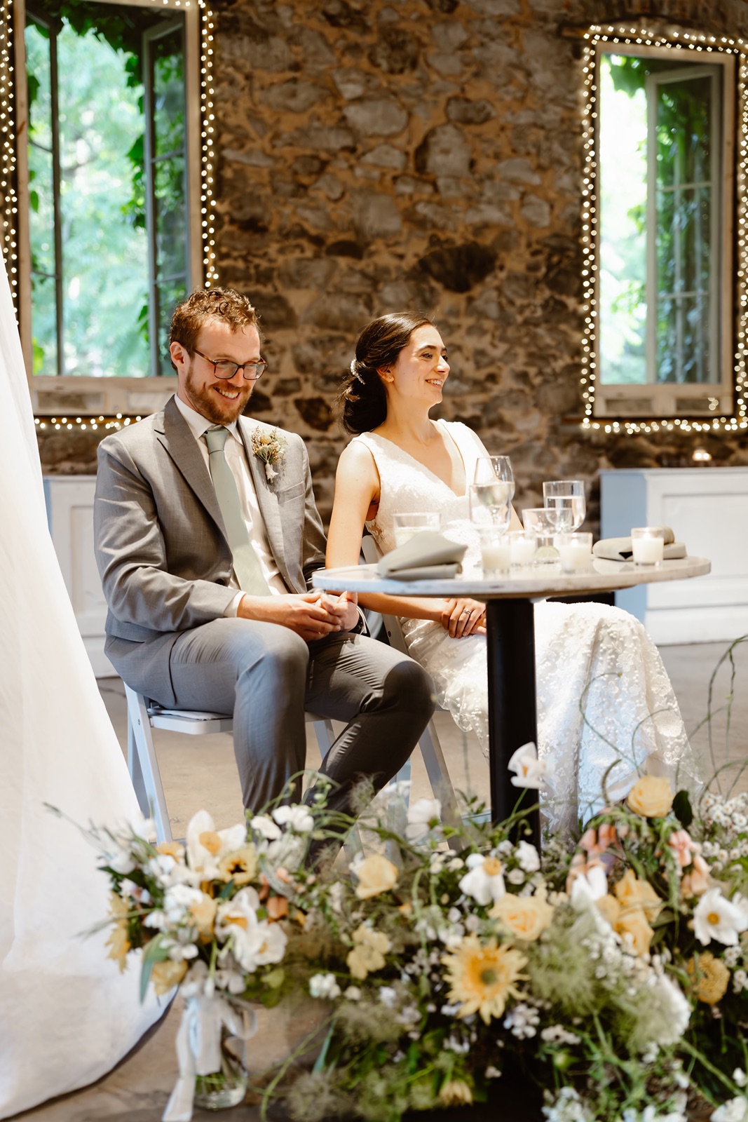 Bride and groom listen to toasts at the Miners Foundry wedding reception