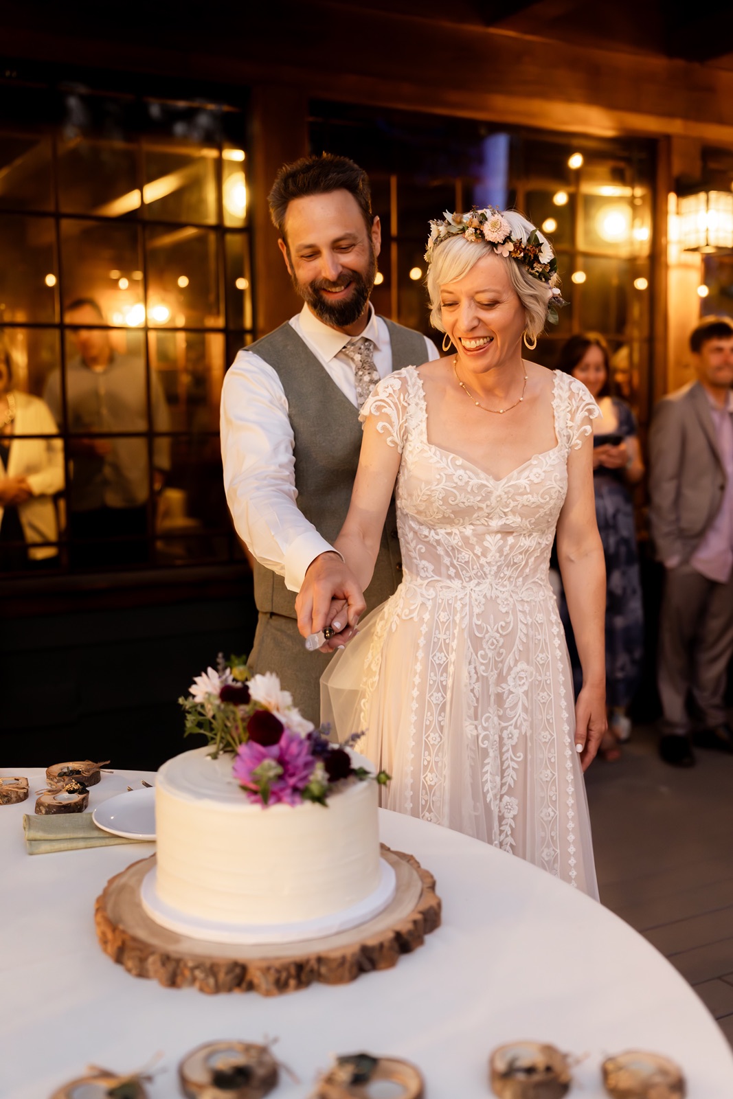 Bride and groom cut their wedding cake at the Rainbow Lodge reception