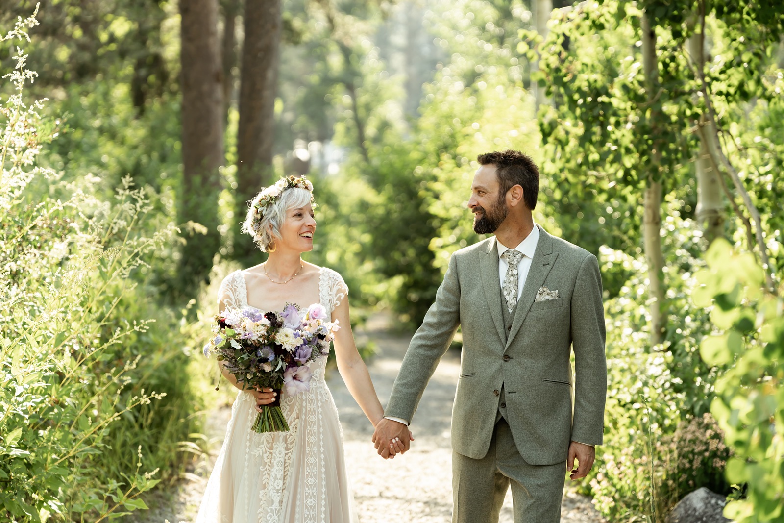 Couple holds hands at Rainbow Lodge in Soda Springs