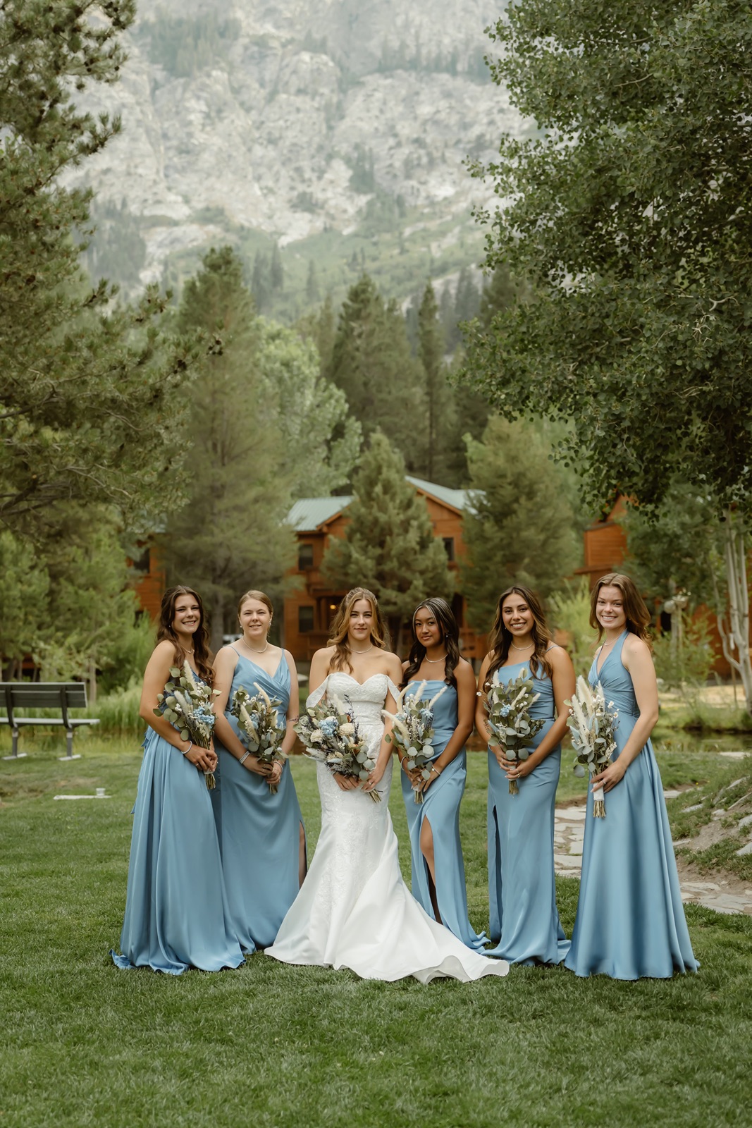 Bride with bridesmaids in blue dresses at the Double Eagle Resort wedding