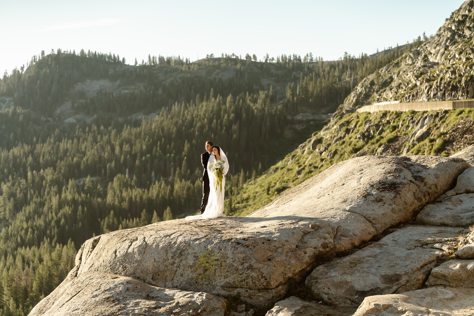 Bride and groom hike at Donner Lake Overlook